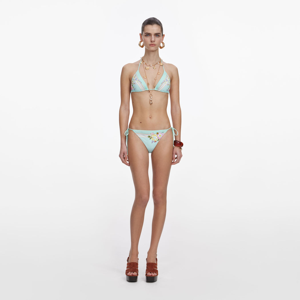 Front view of a woman wearing the Mint Floral Bikini Bottoms