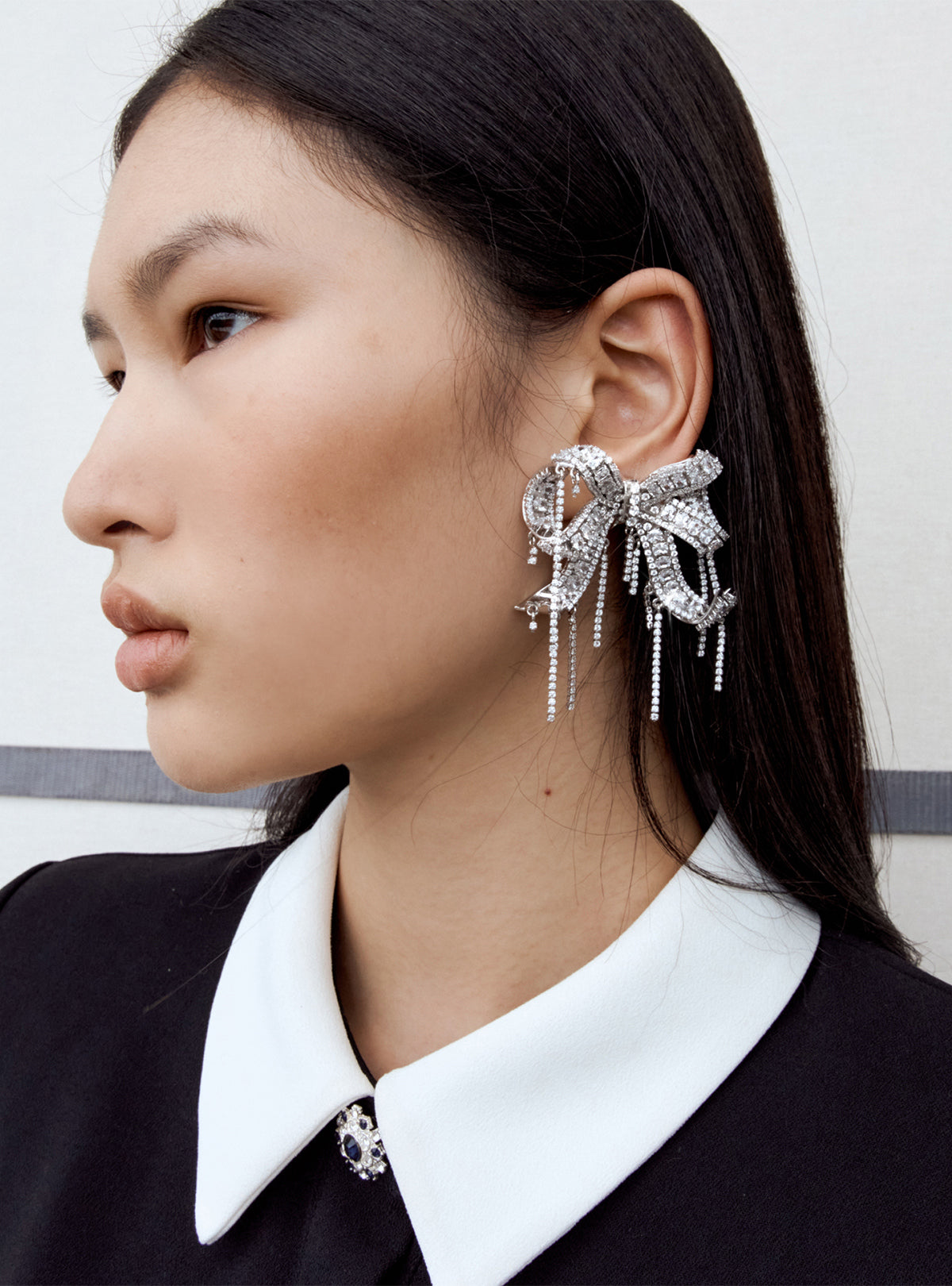 A close up of the fabric for the Crystal Embellished Bow Earrings