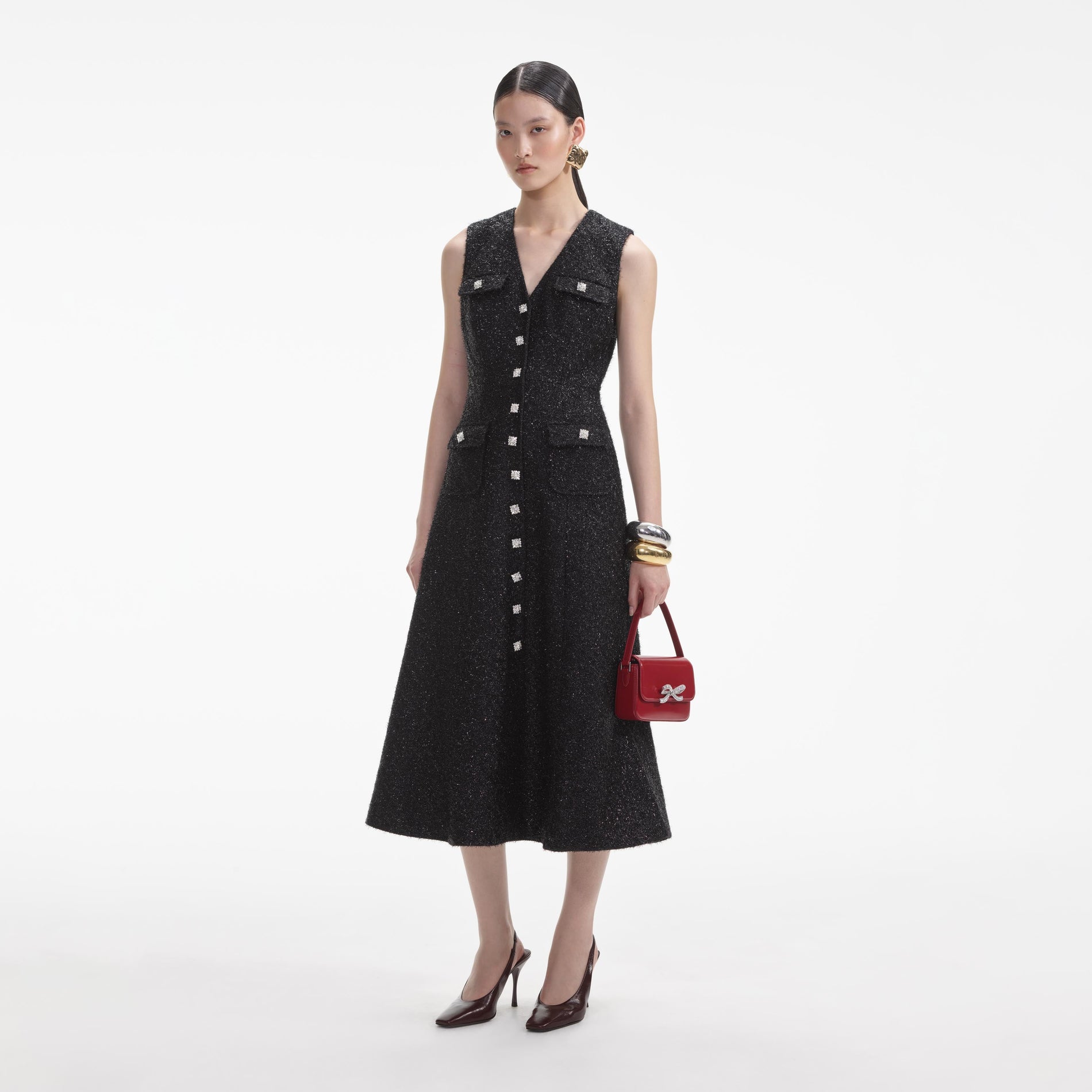 Side view of a woman wearing the Black Tinsel Boucle Buttoned Midi Dress