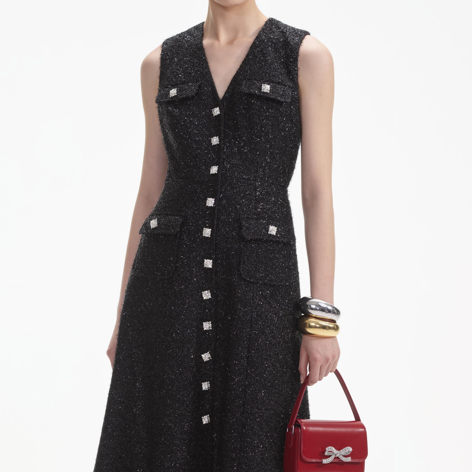 Side view of a woman wearing the Black Tinsel Boucle Buttoned Midi Dress
