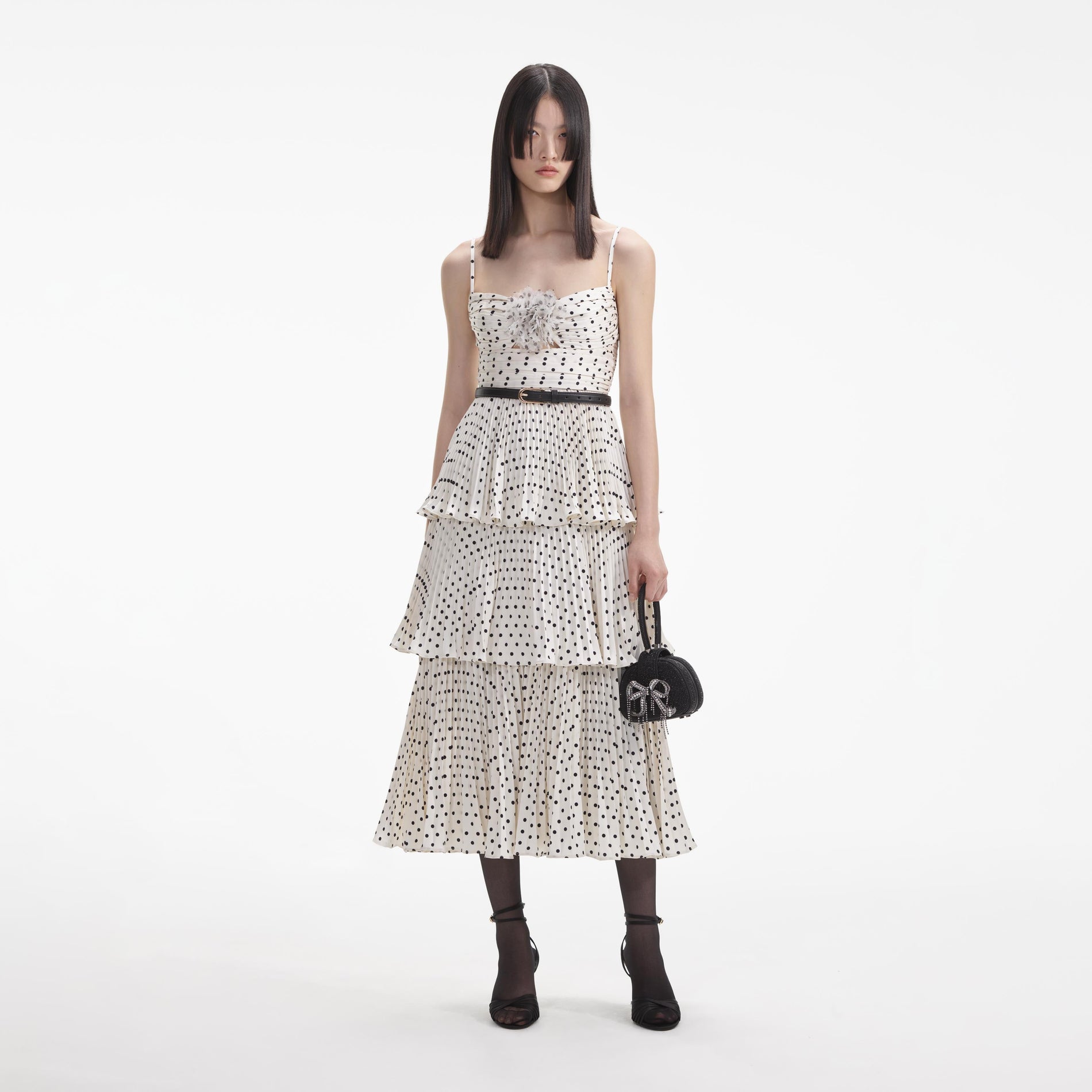 Front view of a woman wearing the Cream Polka Dot Tiered Midi Dress