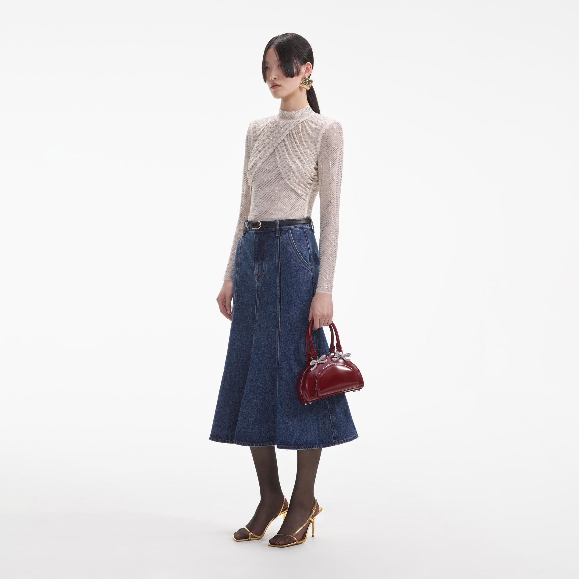 Side view of a woman wearing the Champagne Rhinestone Mesh Top