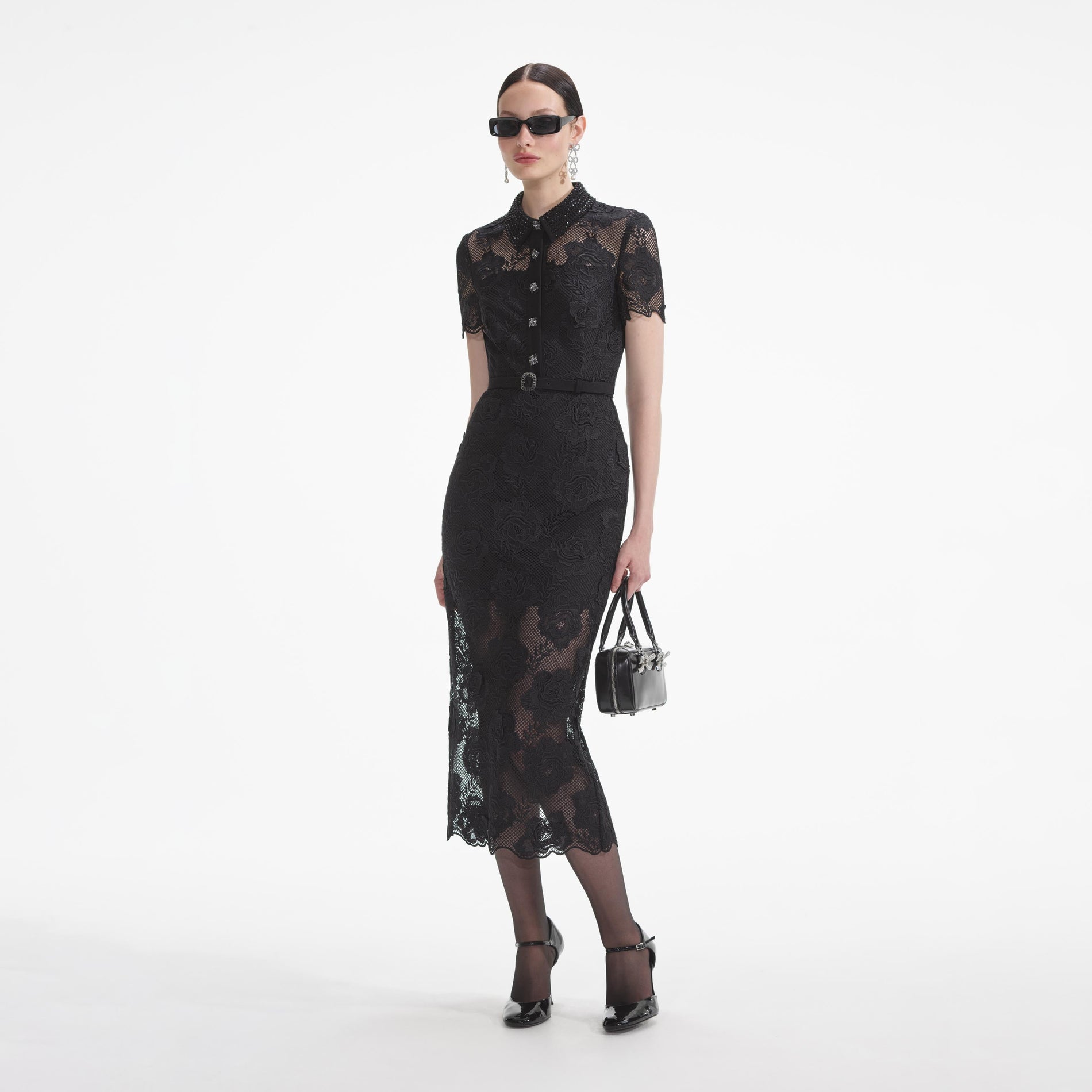 Side view of a woman wearing the Black Lace Diamante Midi Dress