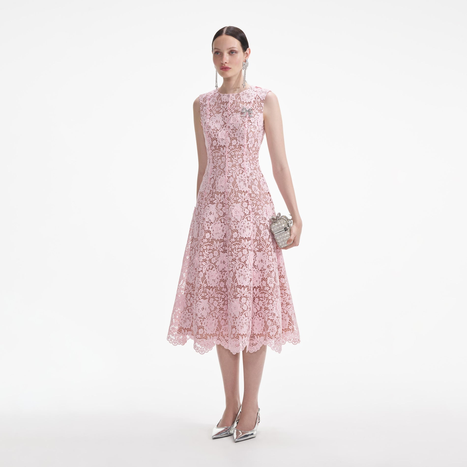 Side view of a woman wearing the Pink Flower Lace Midi Dress