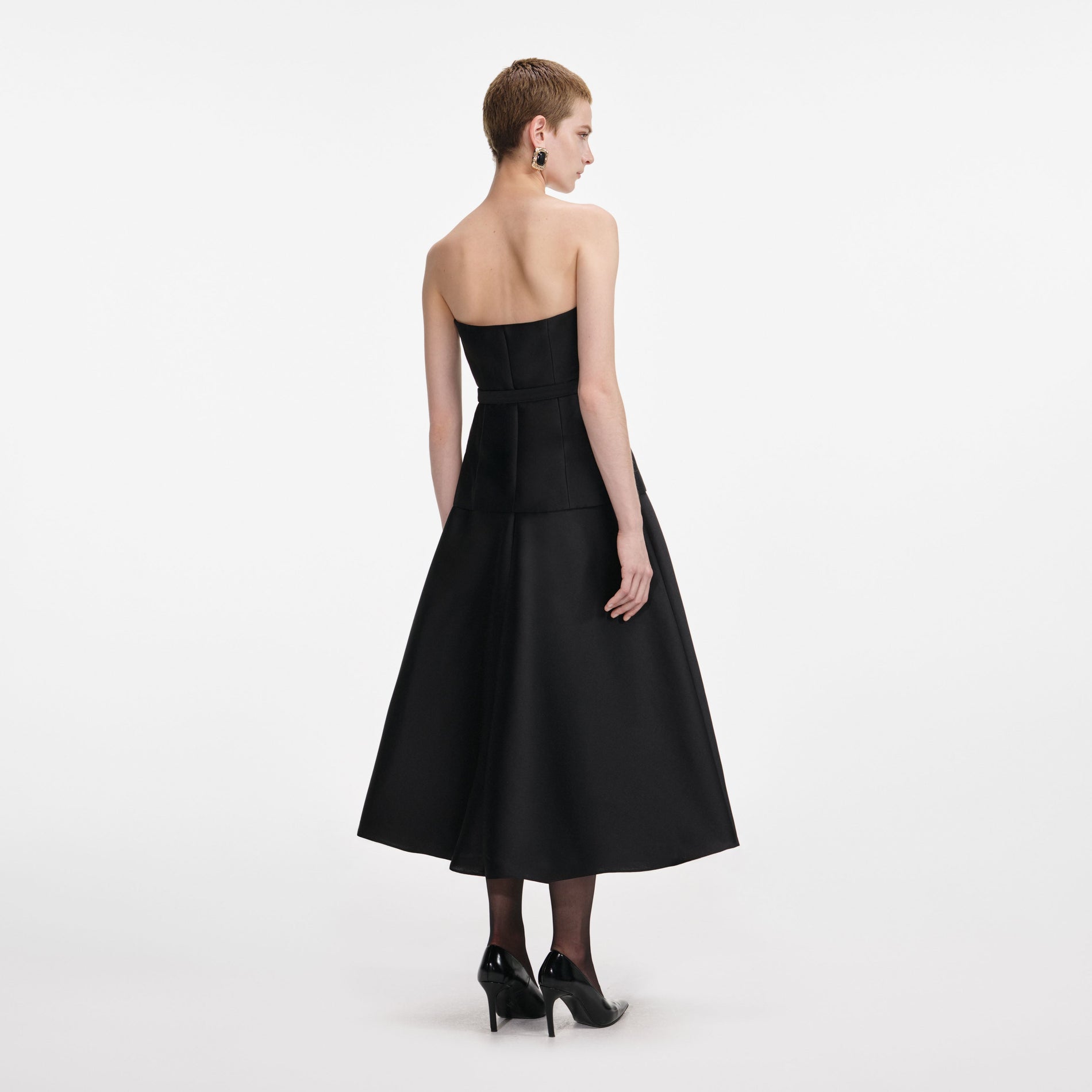 Back view of a woman wearing the Black Taffeta Bandeau Midi Dress