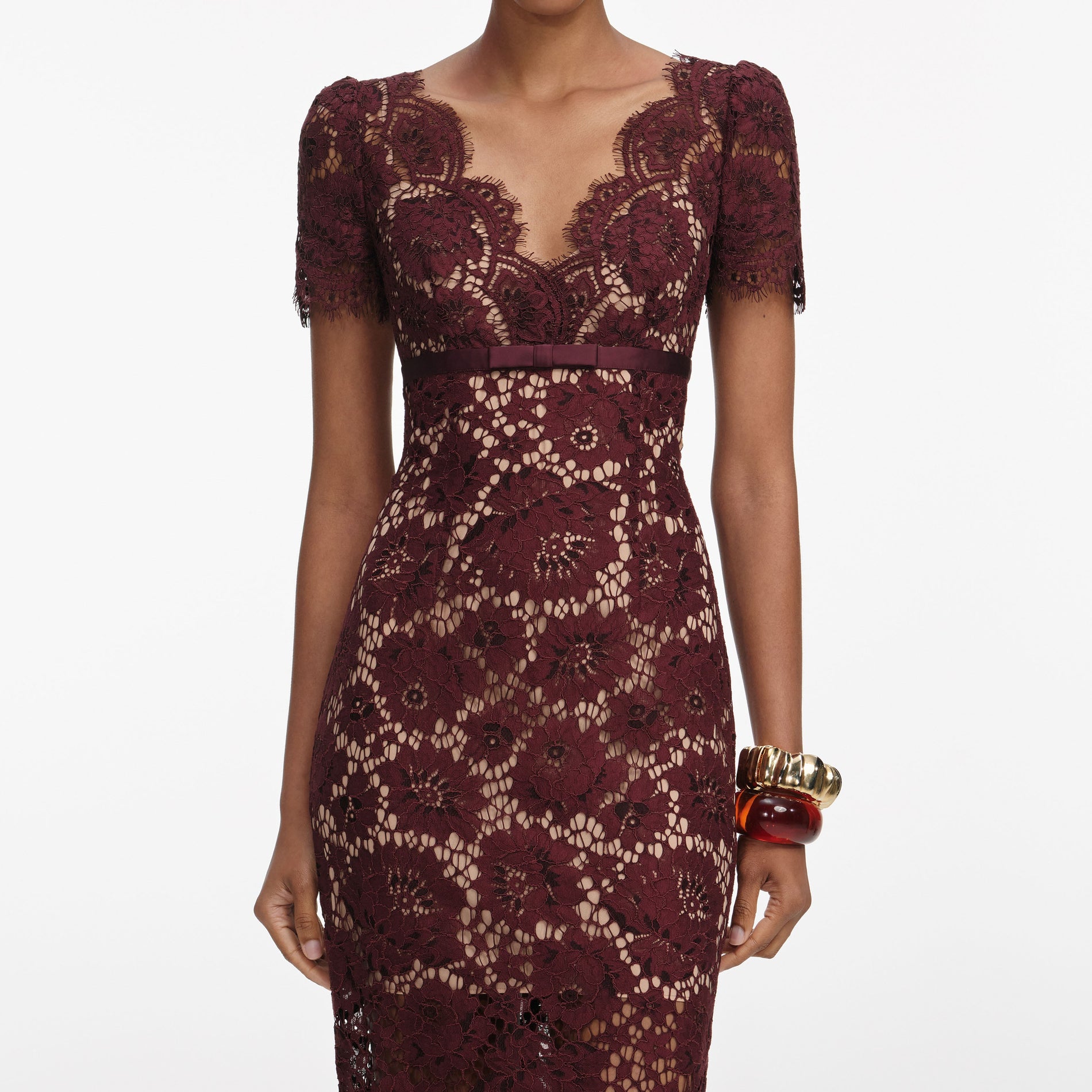 A close up of a woman wearing the Burgundy Floral Lace Midi Dress