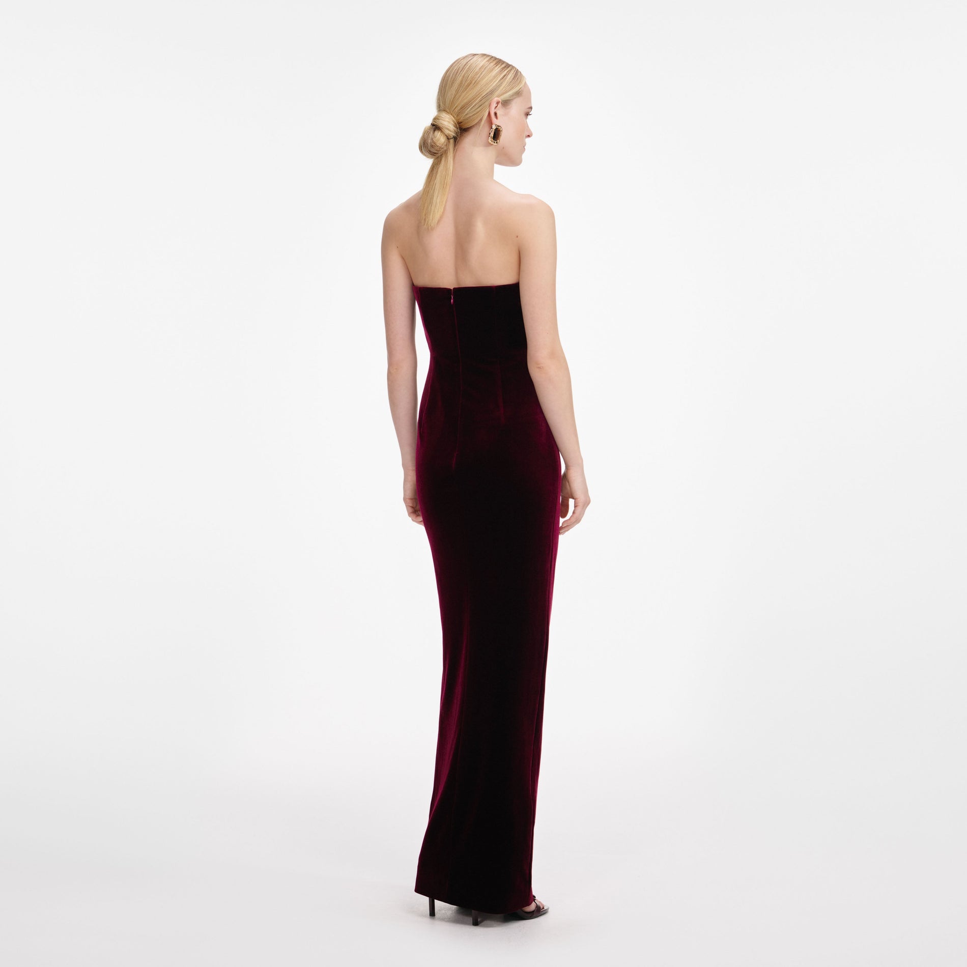 Back view of a woman wearing the Burgundy Velvet Bandeau Maxi Dress