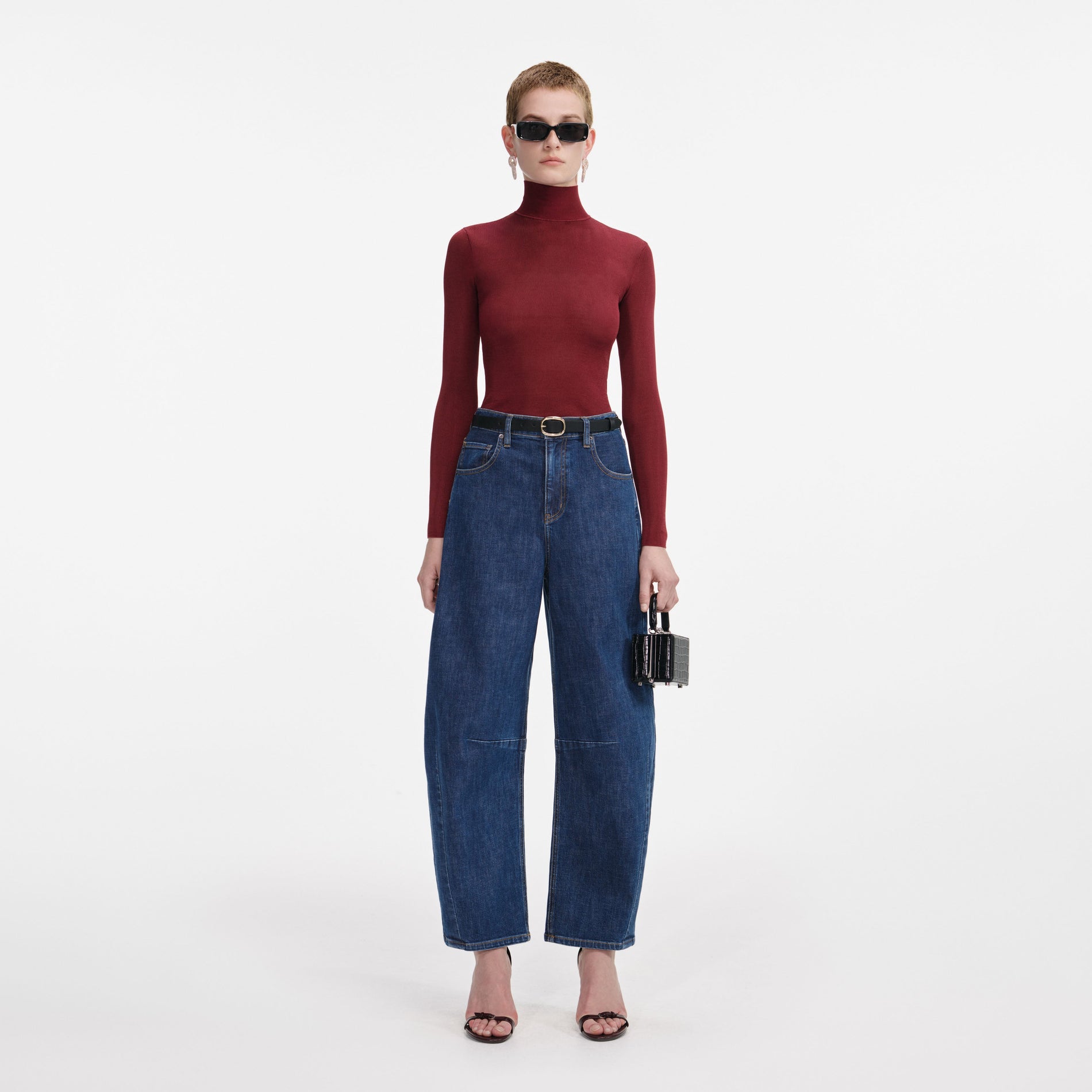 Front view of a woman wearing the Burgundy Viscose Knit Top