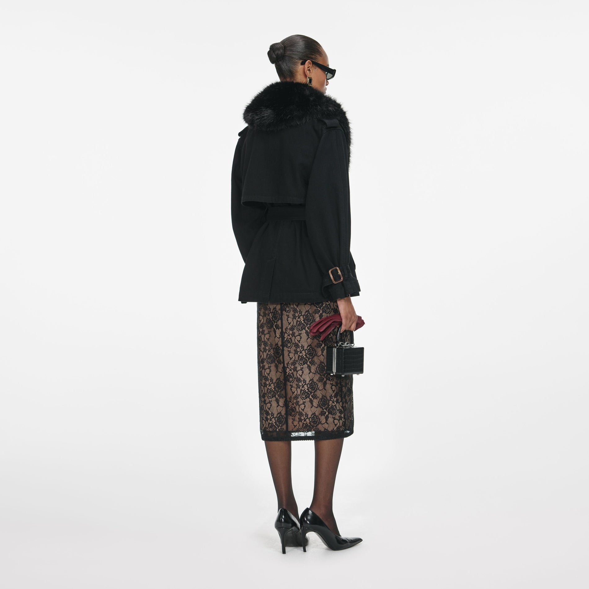 Back view of a woman wearing the Black Denim Fur Collar Jacket