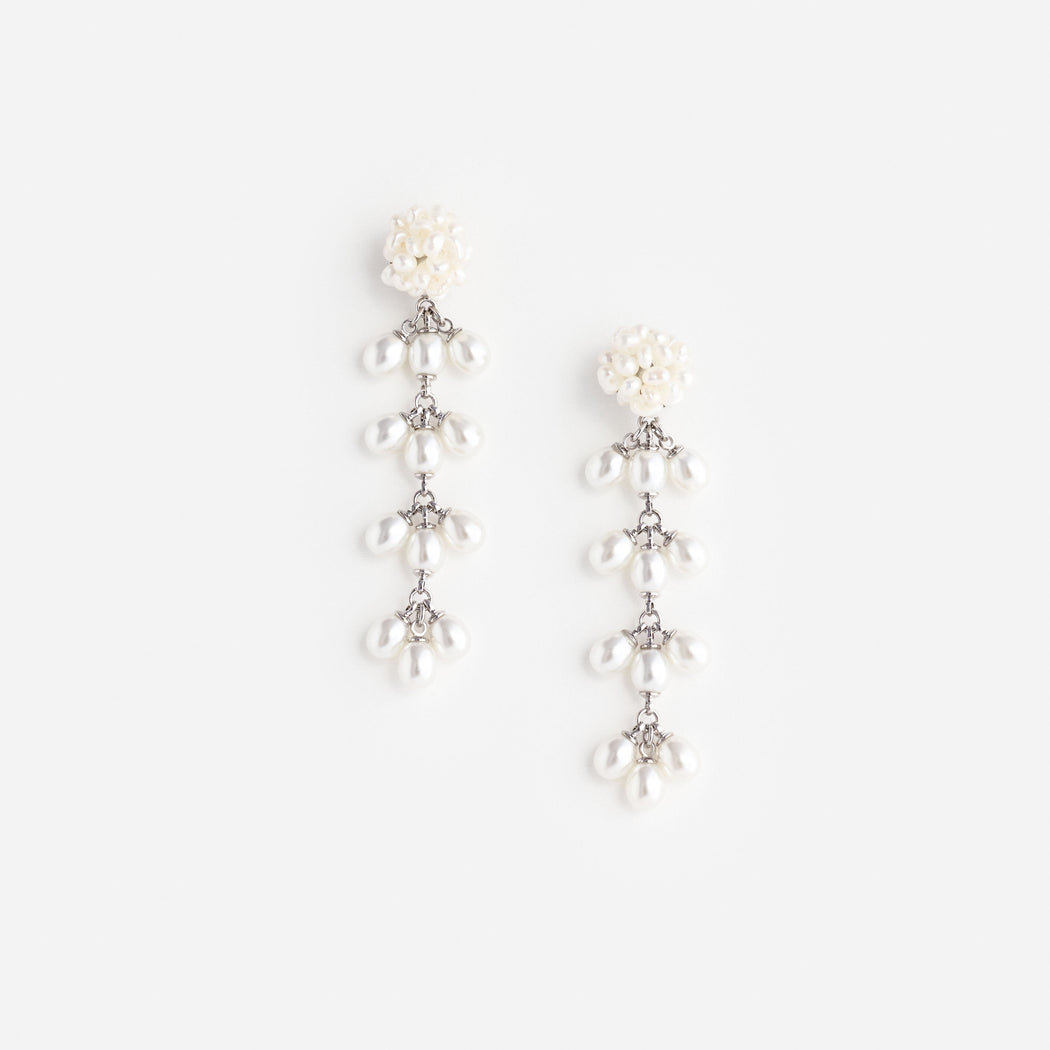 White pearl drop earrings with silver chains