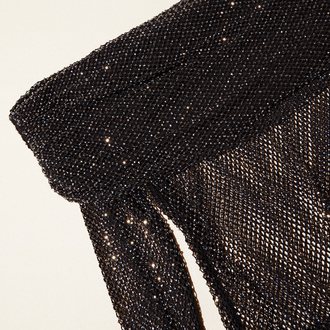A close up of the fabric for the Black Rhinestone Fishnet Top