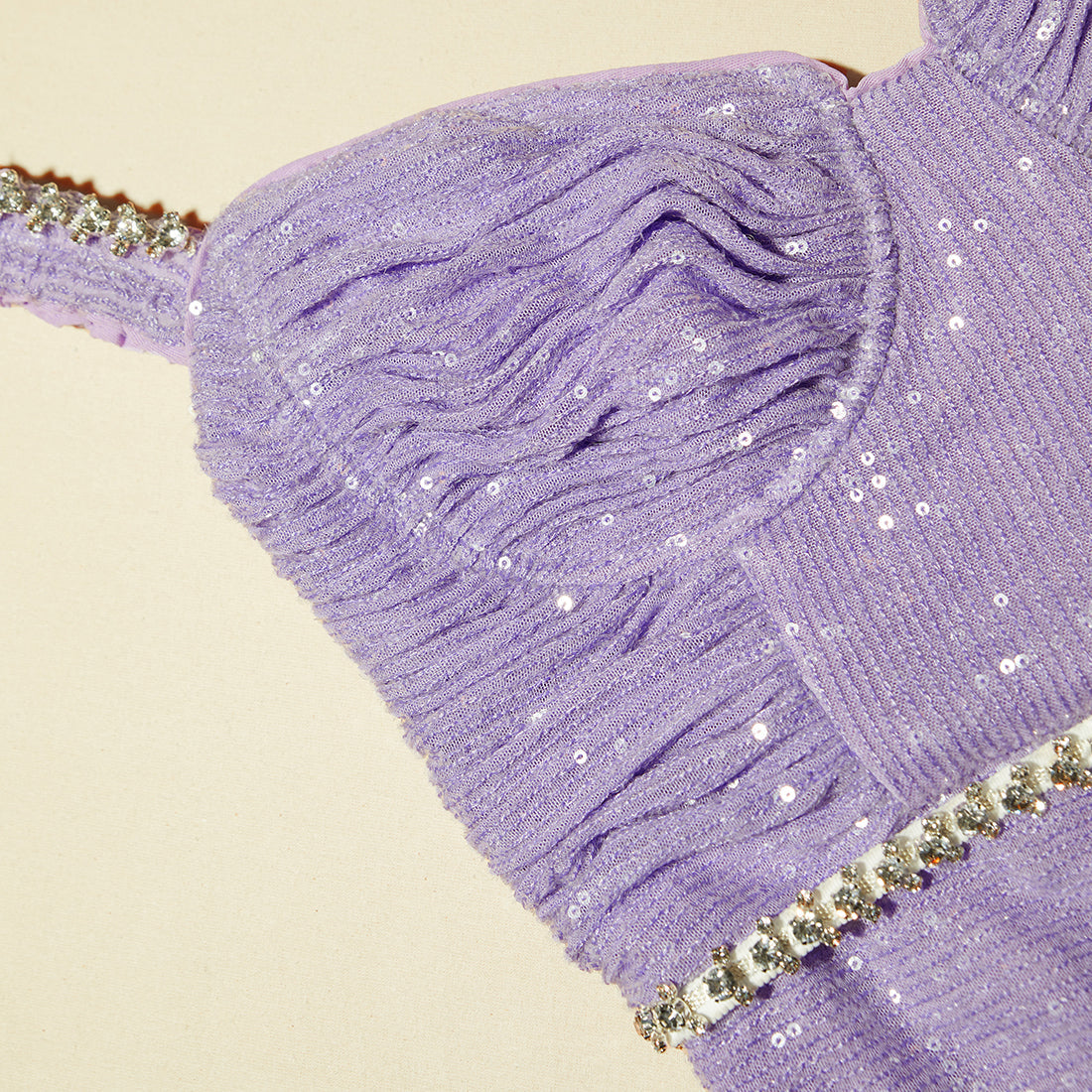A close up of the fabric for the Lilac Sequin Midi Dress