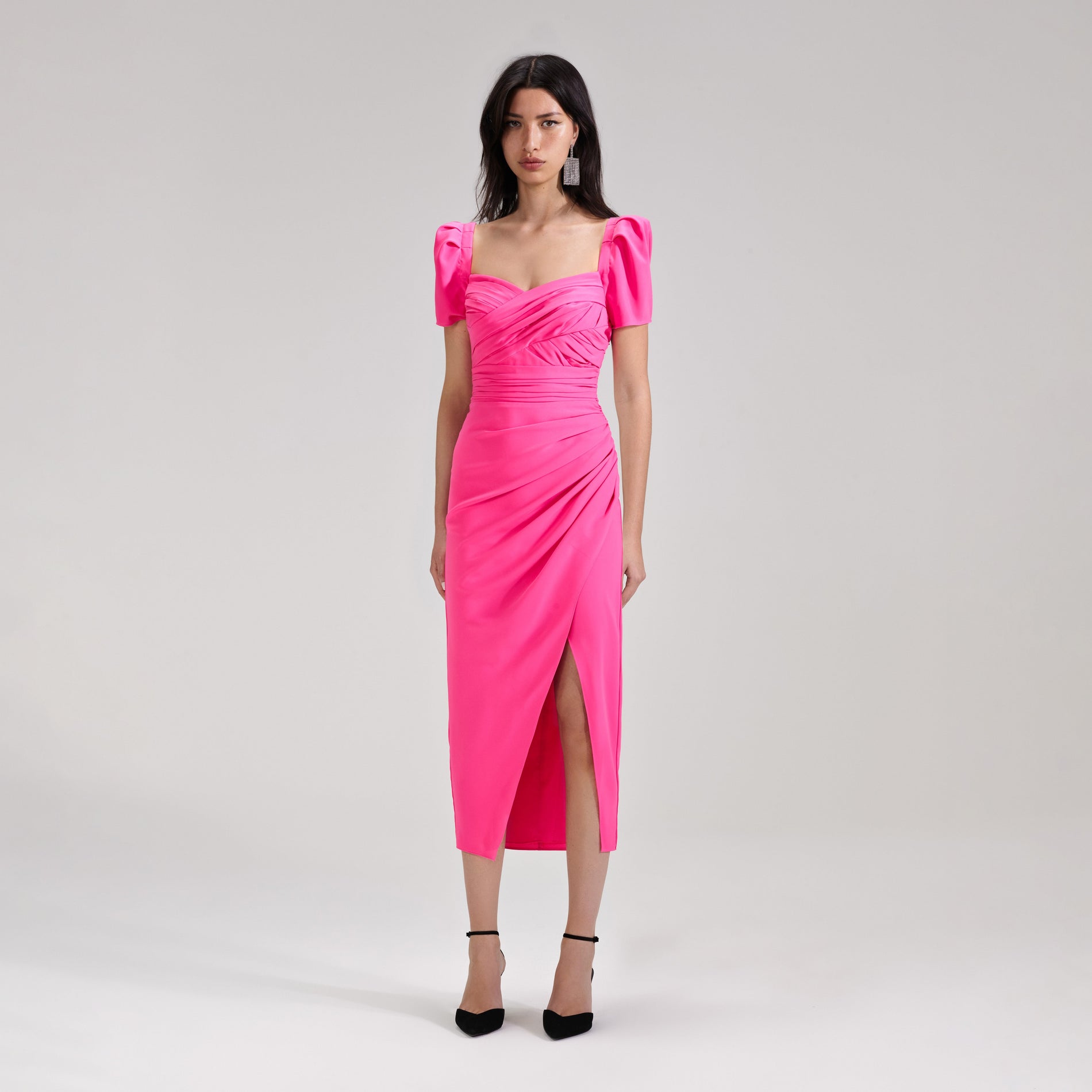 A woman wearing the Bright Pink Iris Midi Dress
