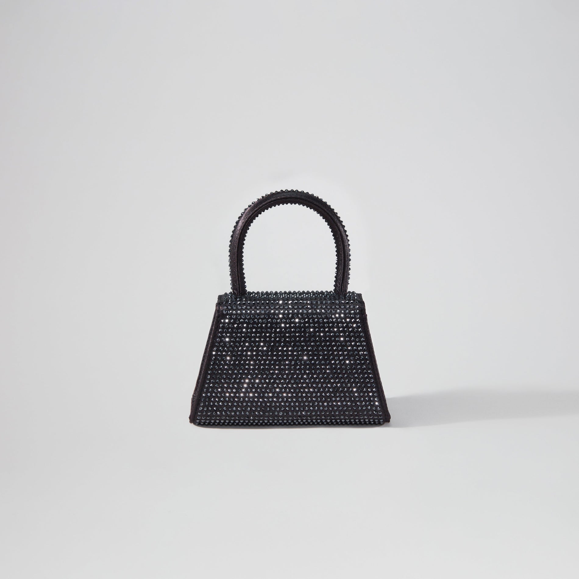 Back view of a woman wearing the Black Rhinestone Micro Bow Bag