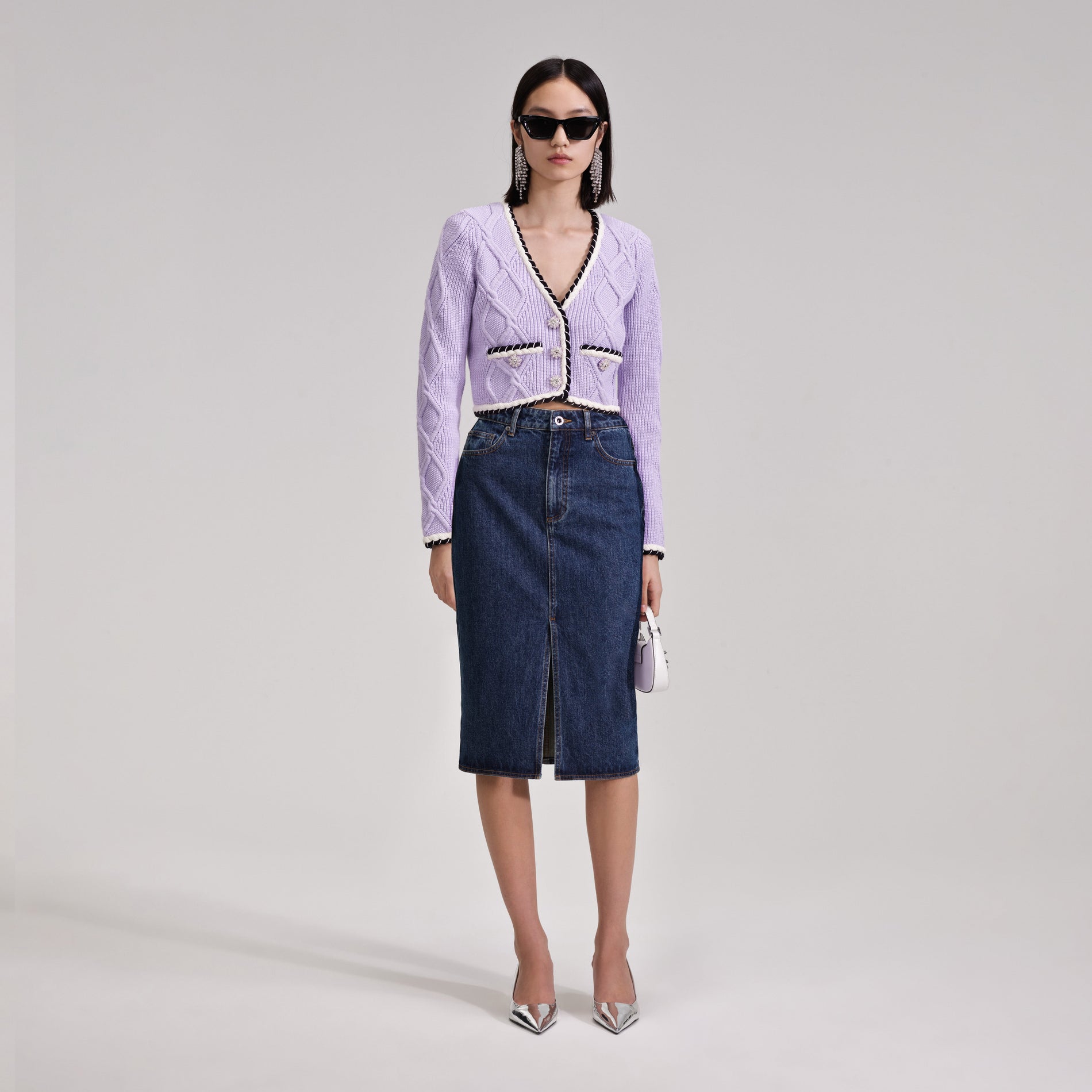 A woman wearing the Denim Midi Skirt