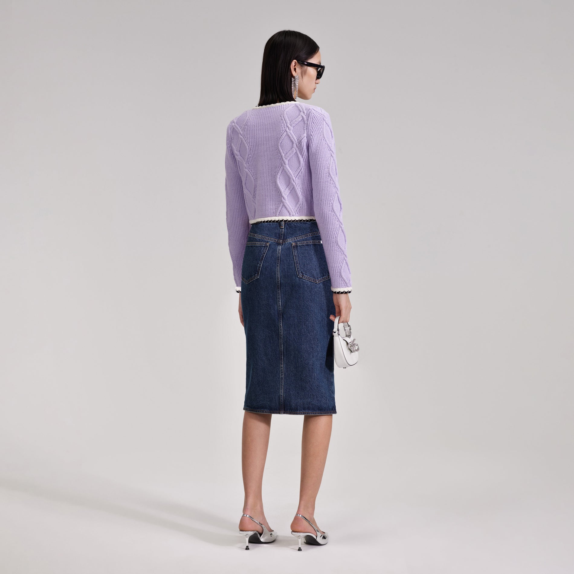 A woman wearing the Denim Midi Skirt