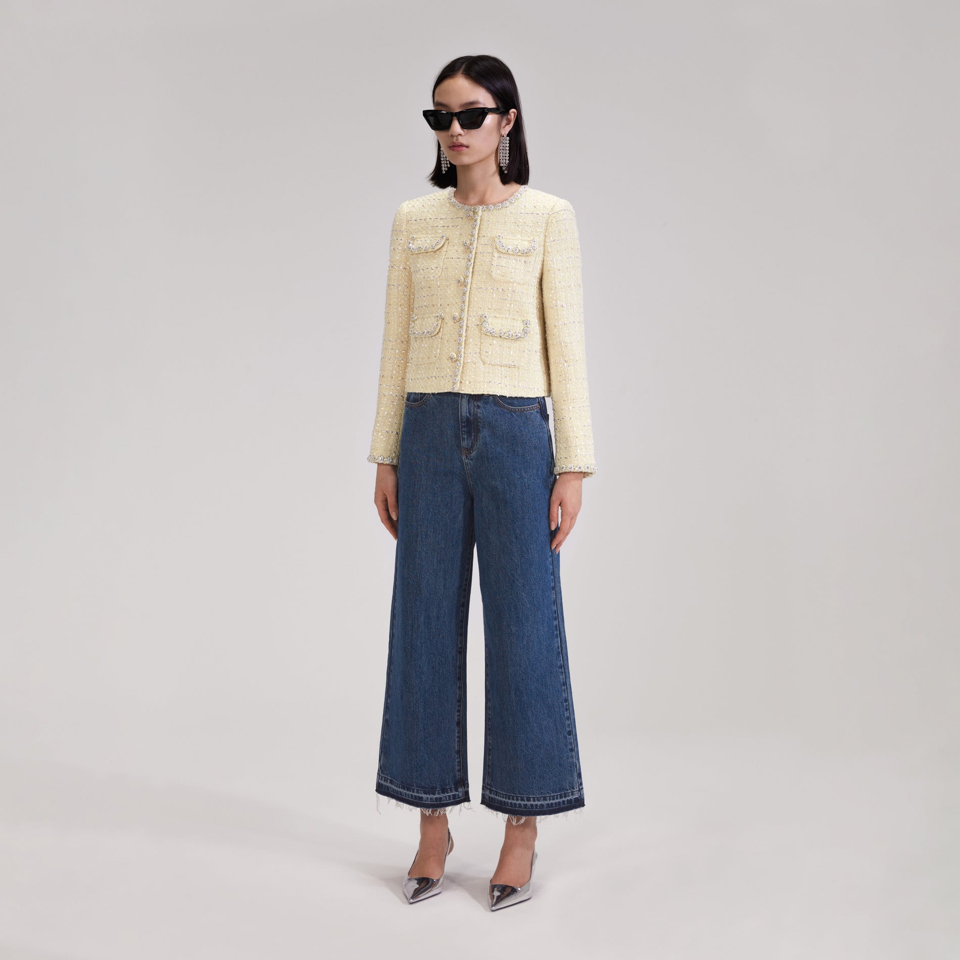 A woman wearing the Yellow Boucle Jacket