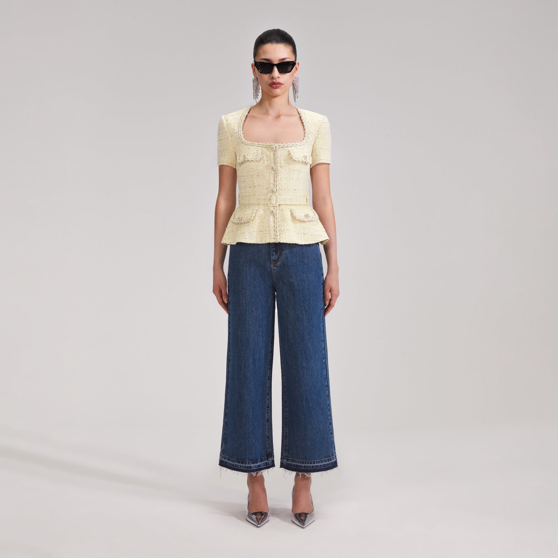 A woman wearing the Yellow Boucle Top