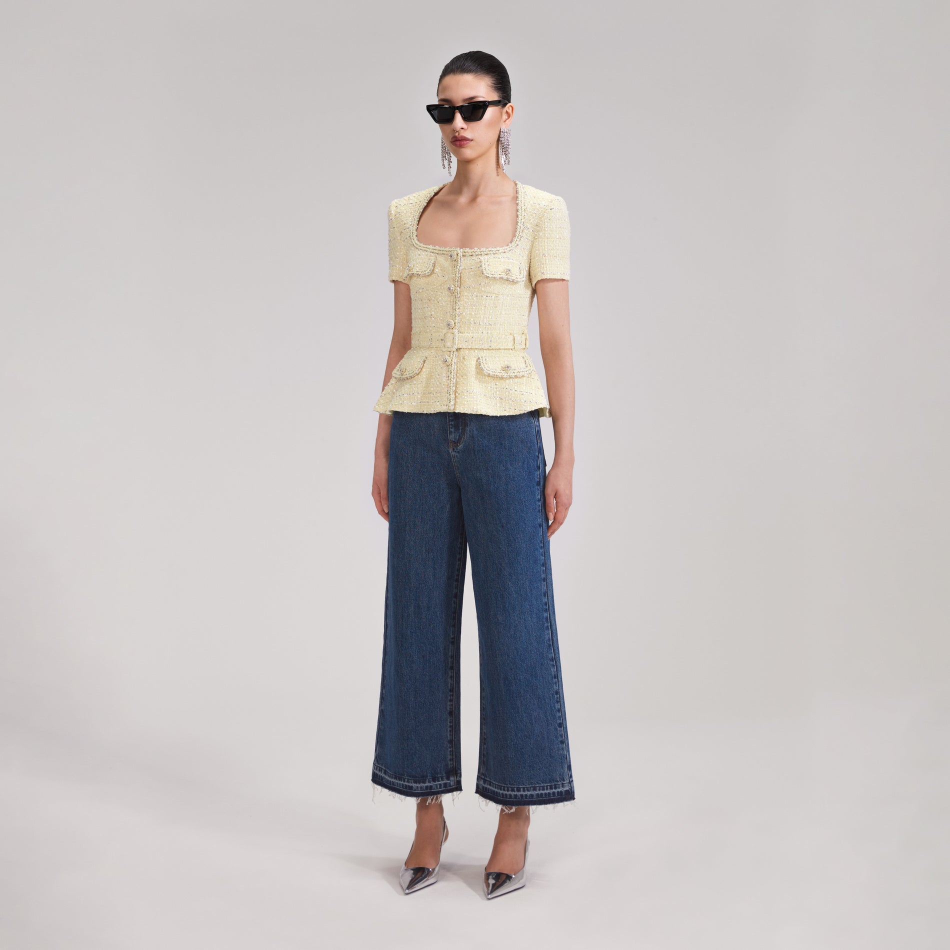 A woman wearing the Yellow Boucle Top