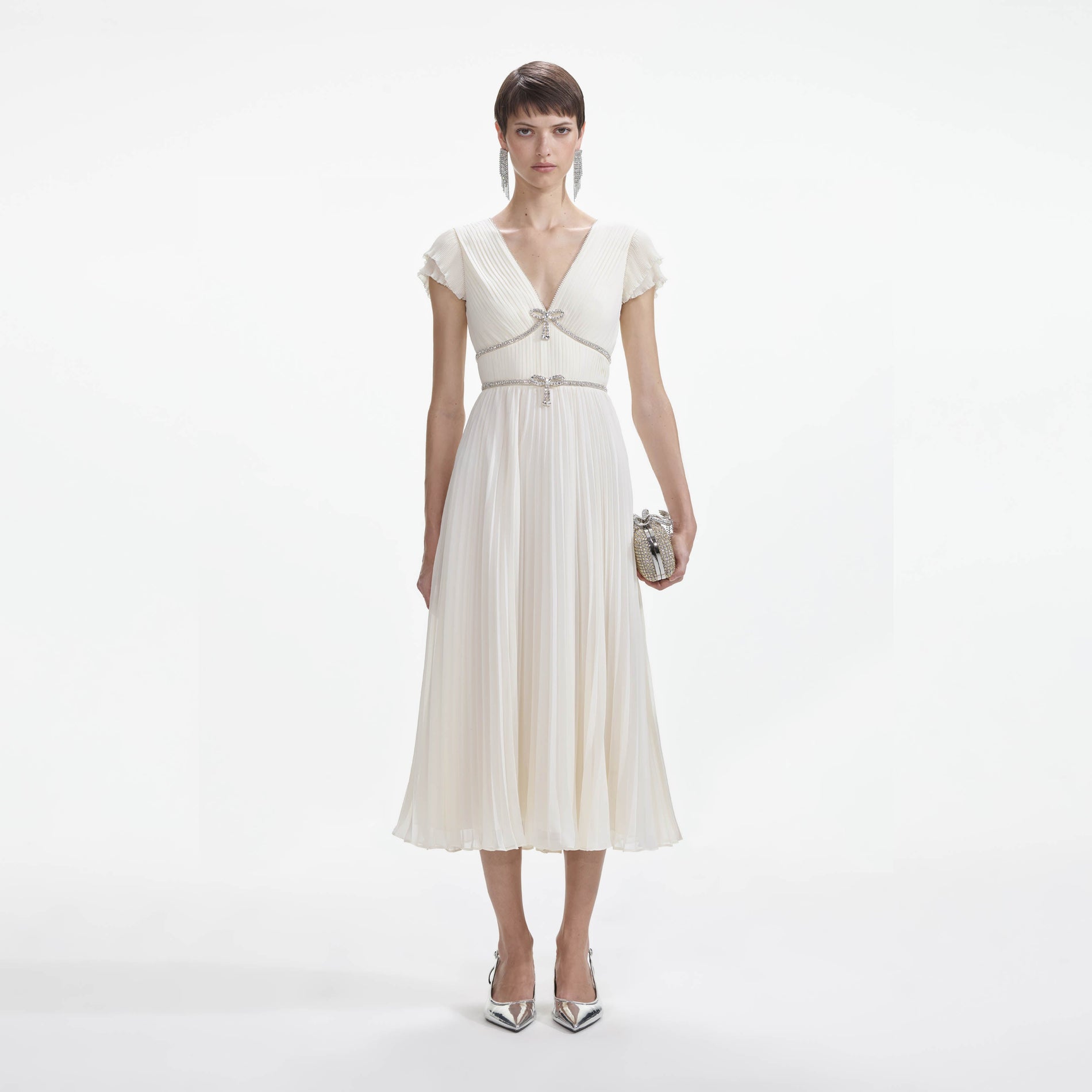 Front view of a woman wearing the Cream Chiffon Pleated Midi Dress