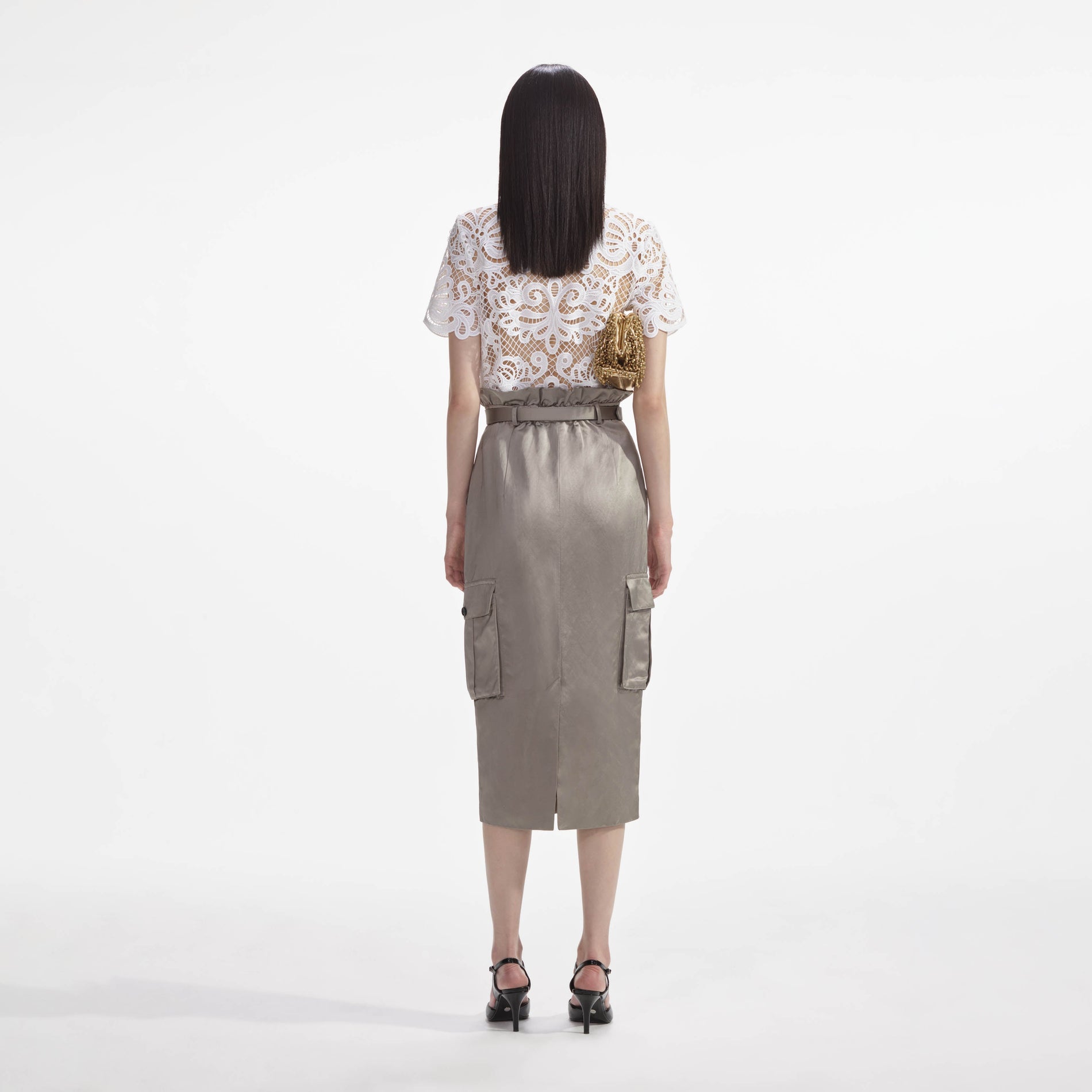 Back view of a woman wearing the White Guipure Lace Top