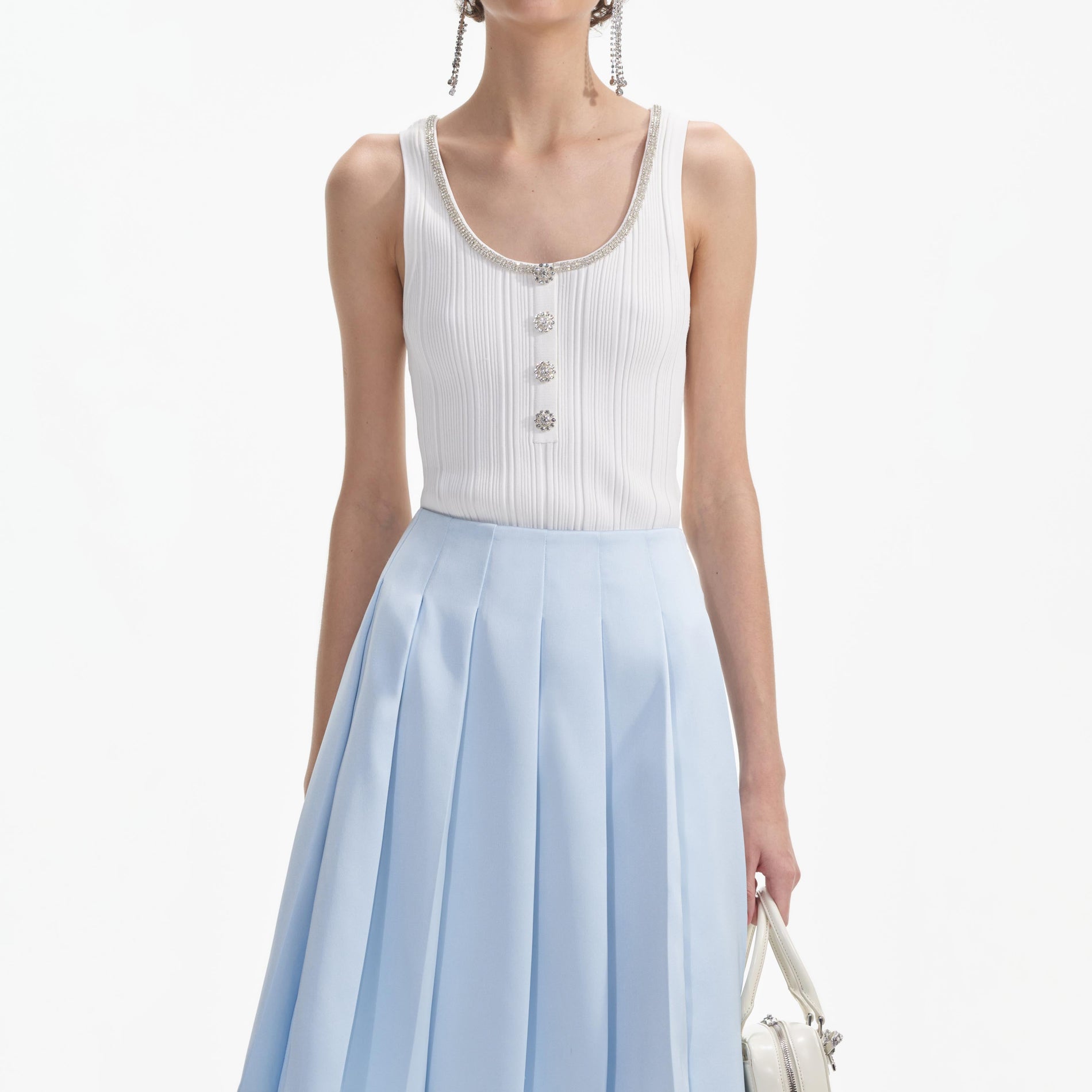 A close up of a woman wearing the Blue Satin Midi Skirt