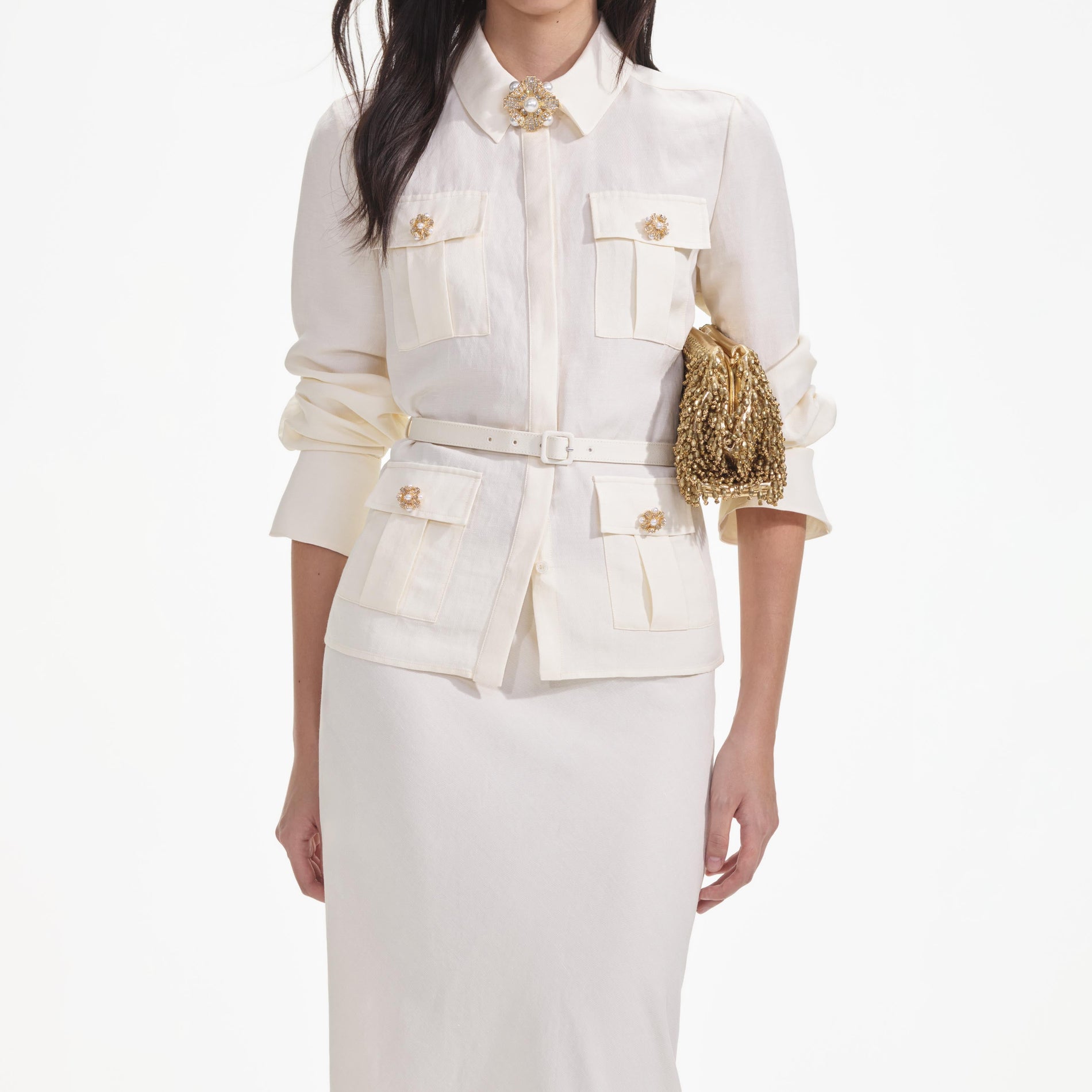 A close up of a woman wearing the Cream Linen Maxi Dress