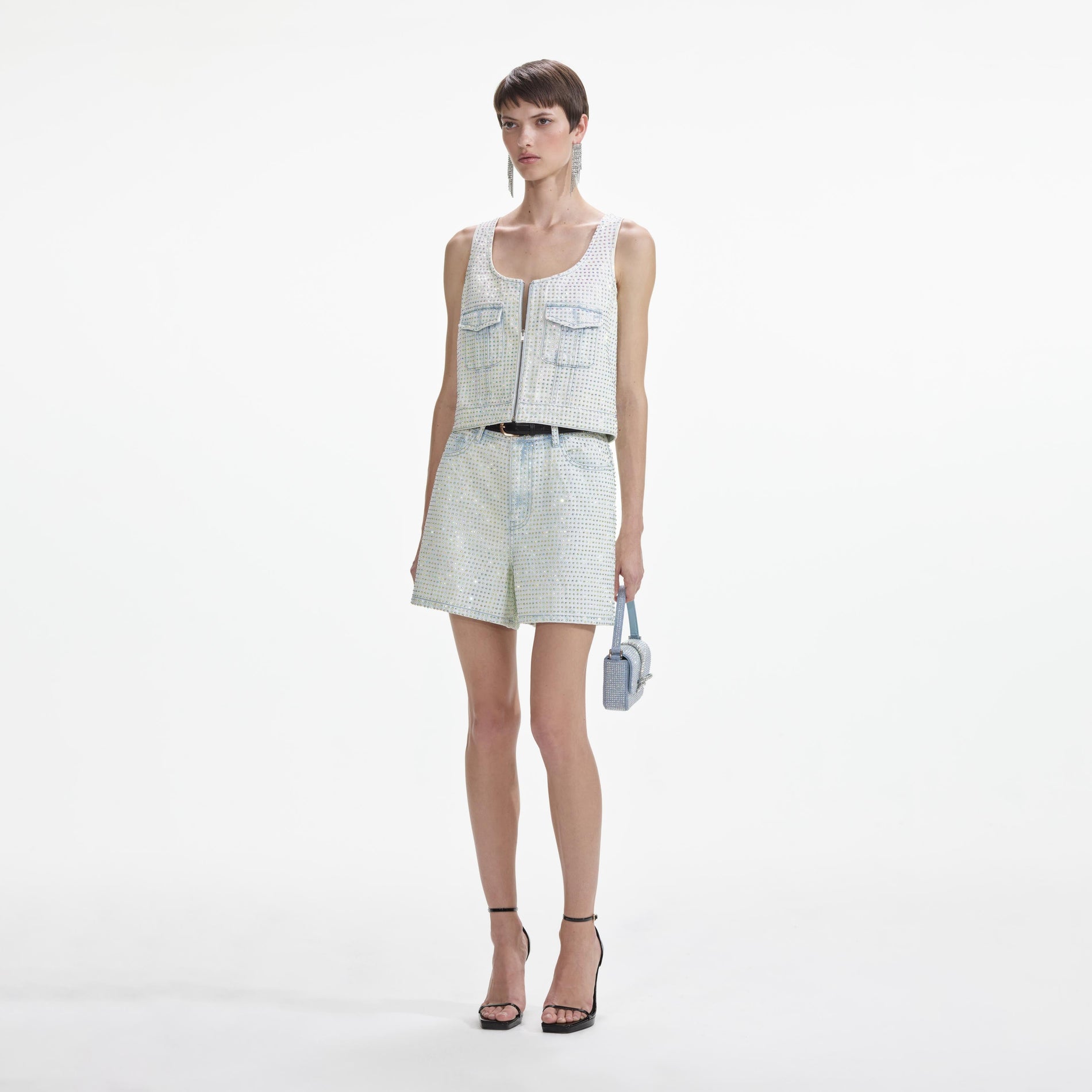 Side view of a woman wearing the Rhinestone Denim Shorts