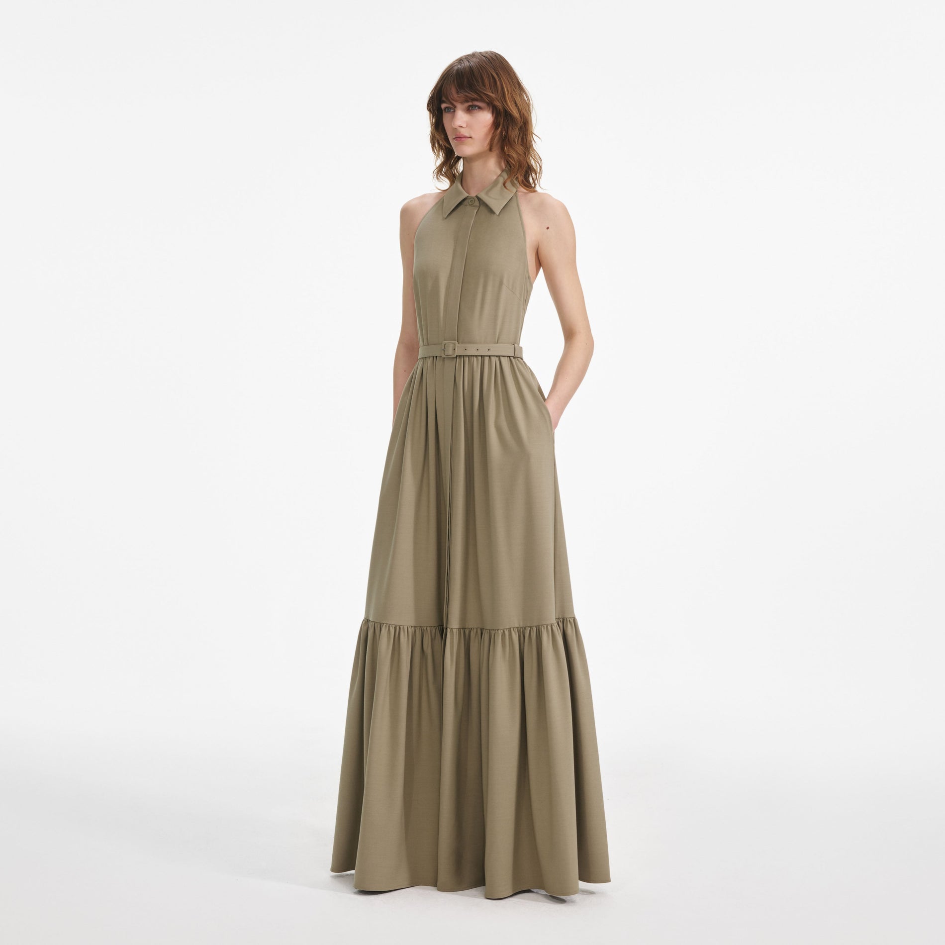 Side view of a woman wearing the Beige Sleeveless Twill Maxi Dress