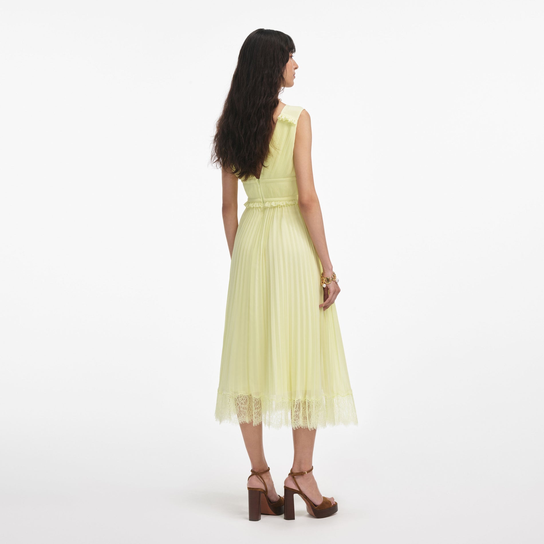 Back view of a woman wearing the Yellow Chiffon Midi Dress