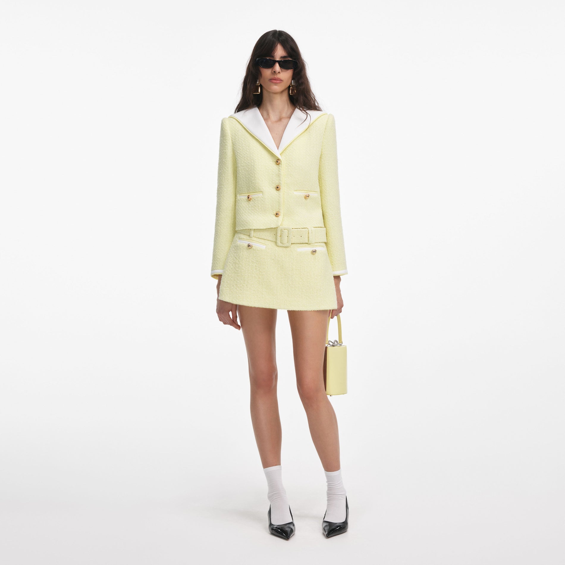 Front view of a woman wearing the Yellow Boucle Skort