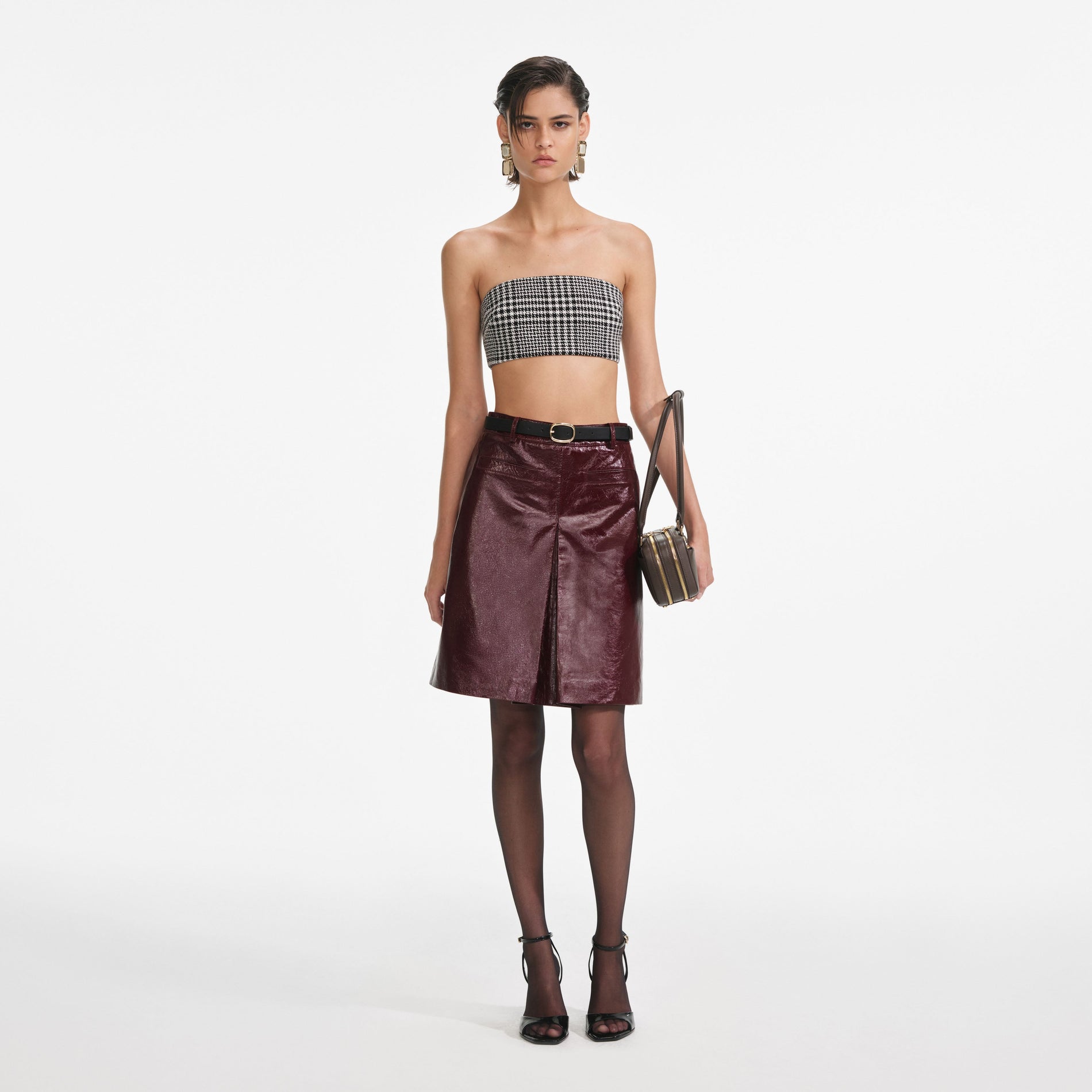 Front view of a woman wearing the Burgundy Leather  Mini Skirt