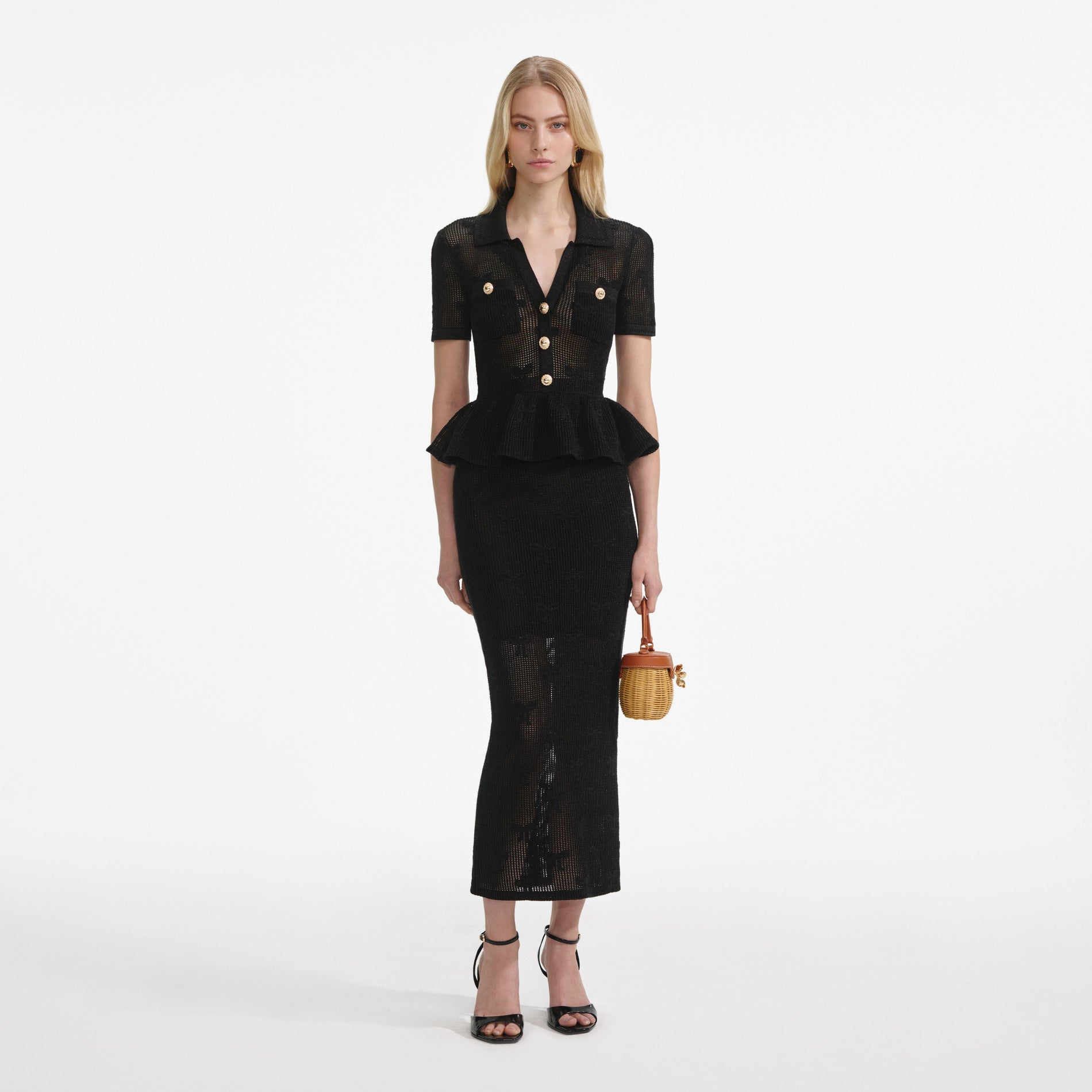 Front view of a woman wearing the Black Bow Crochet Midi Dress