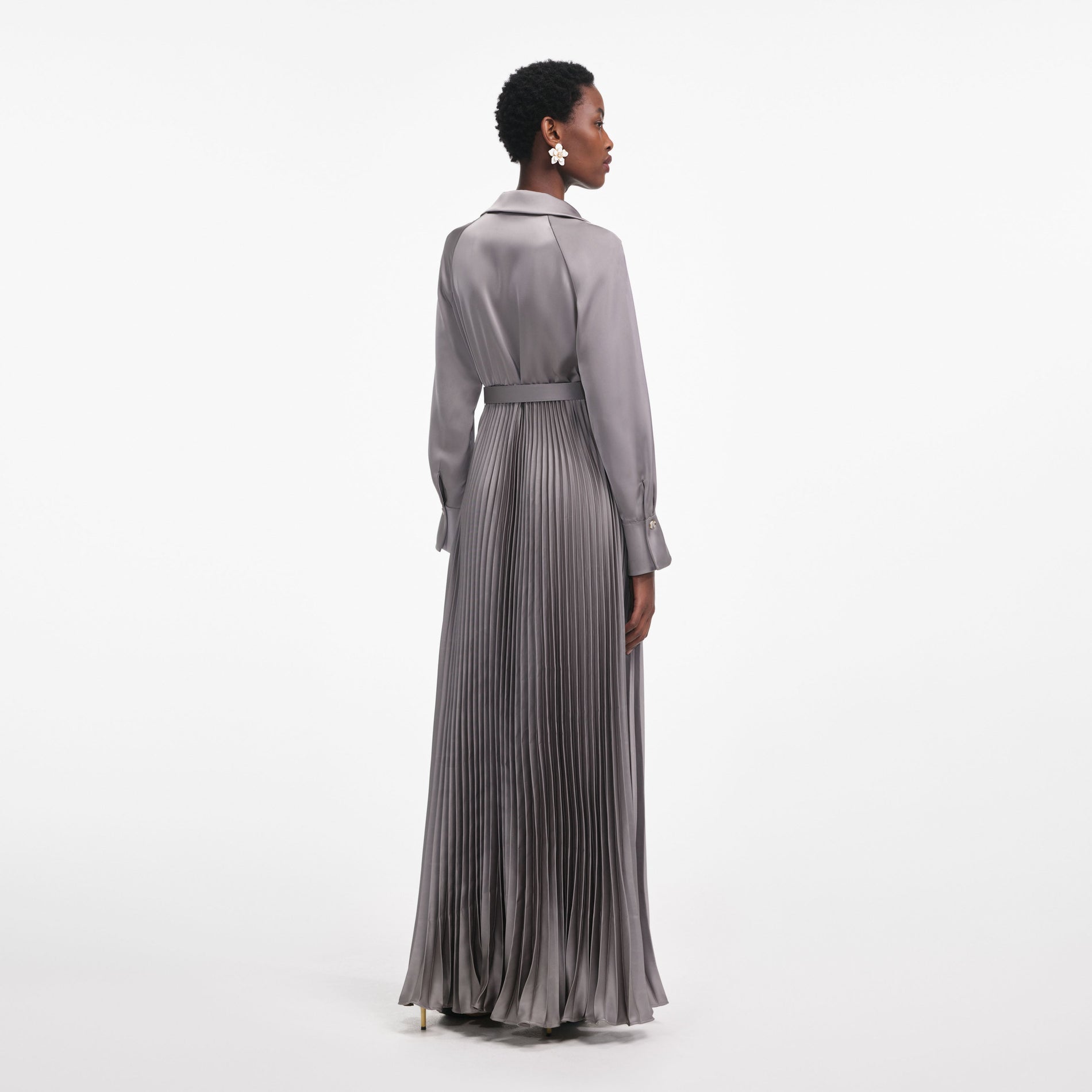 Back view of a woman wearing the Grey Satin Pleated Maxi Dress