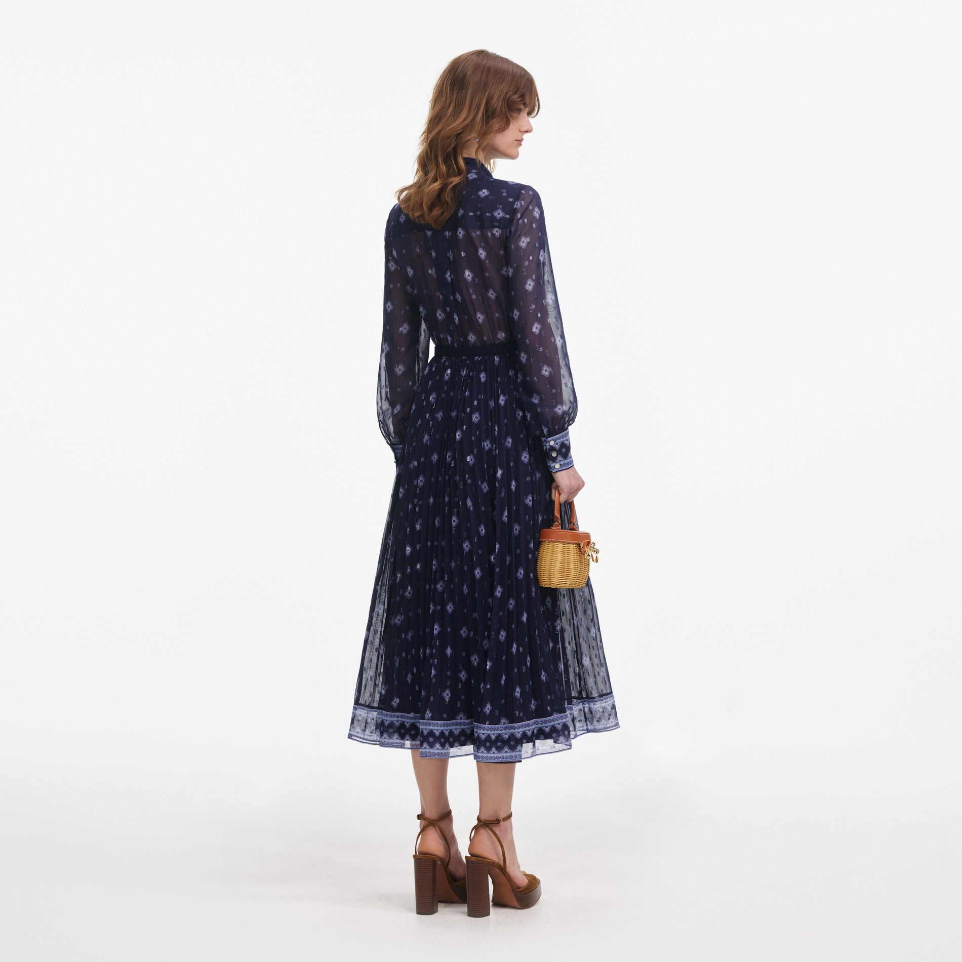 Back view of a woman wearing the Navy Printed Chiffon Midi Dress