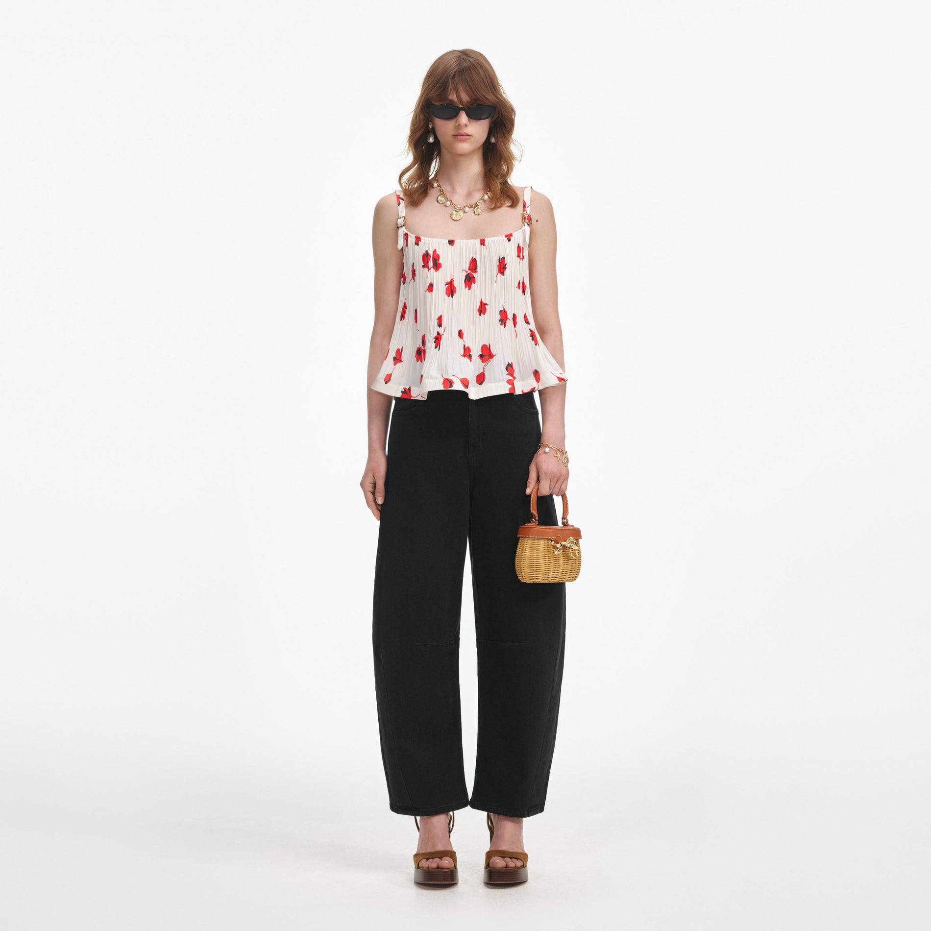 Front view of a woman wearing the Black Barrel Leg Jeans