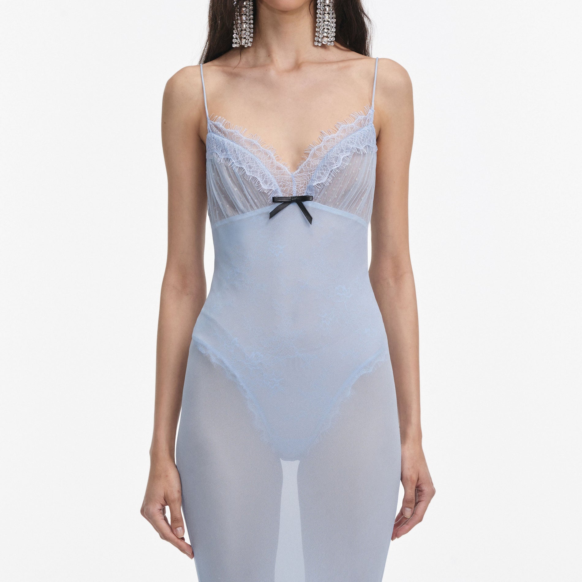 A close up of a woman wearing the Blue Strappy Georgette Maxi Dress