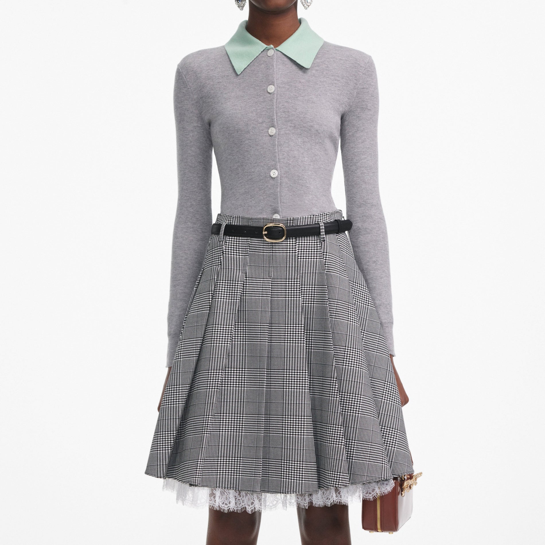 A close up of a woman wearing the Grey Merino Wool Cardigan