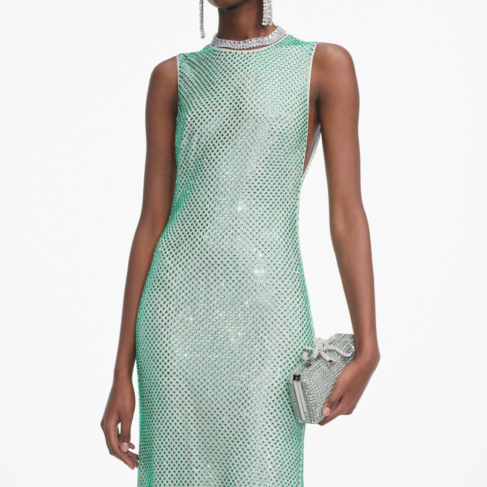 A close up of a woman wearing the Mint Rhinestone Mesh Midi Dress