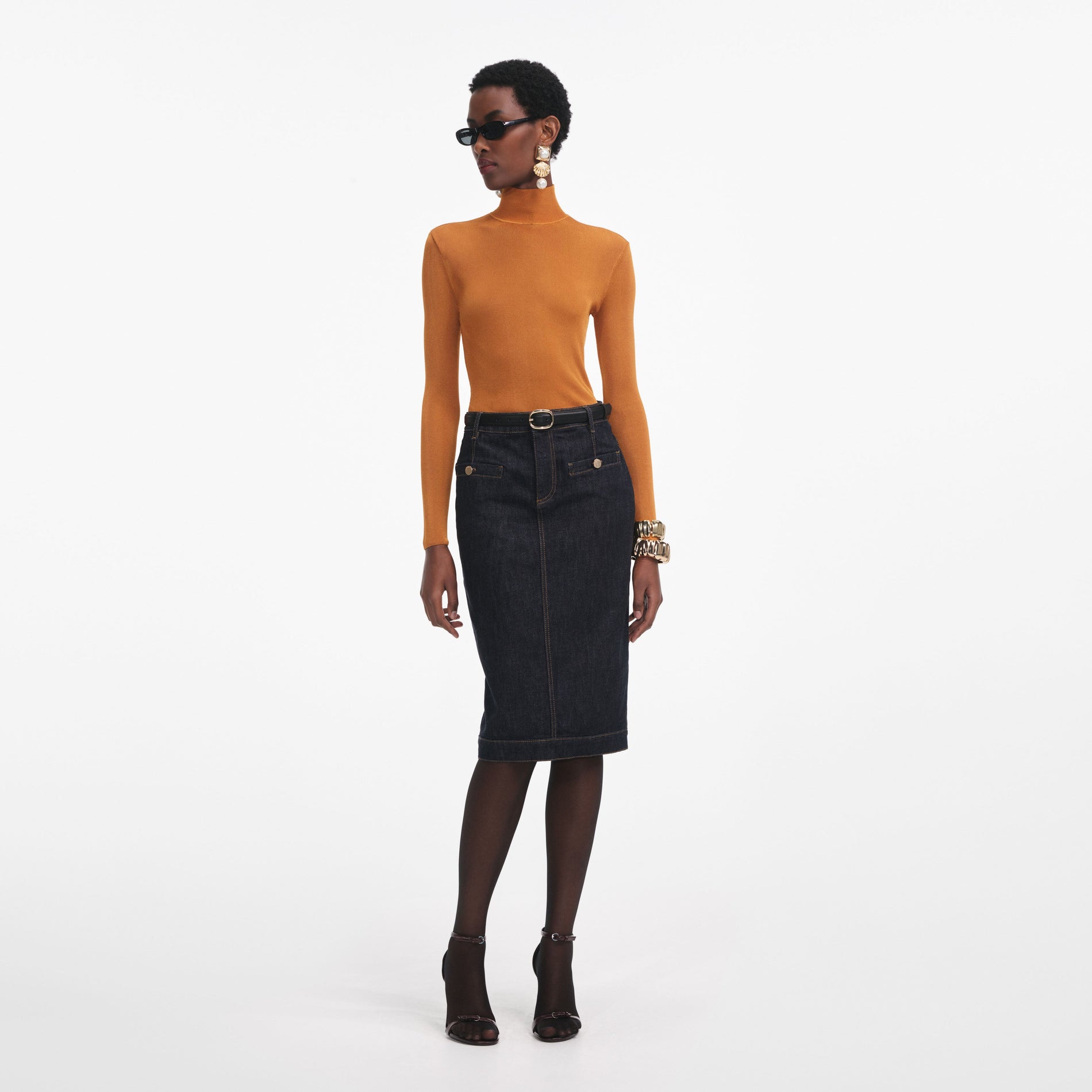 Front view of a woman wearing the Burnt Orange Viscose Knit Top