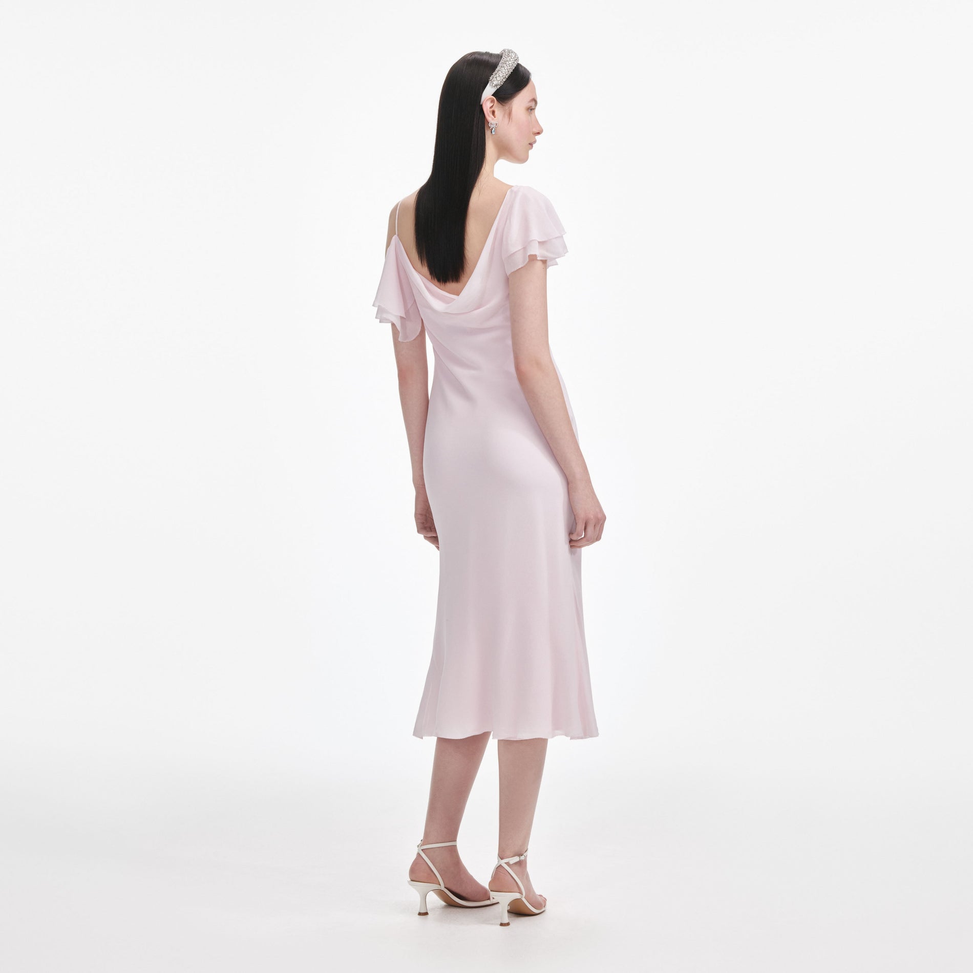 Back view of a woman wearing the Pink Georgette Frill Midi Dress