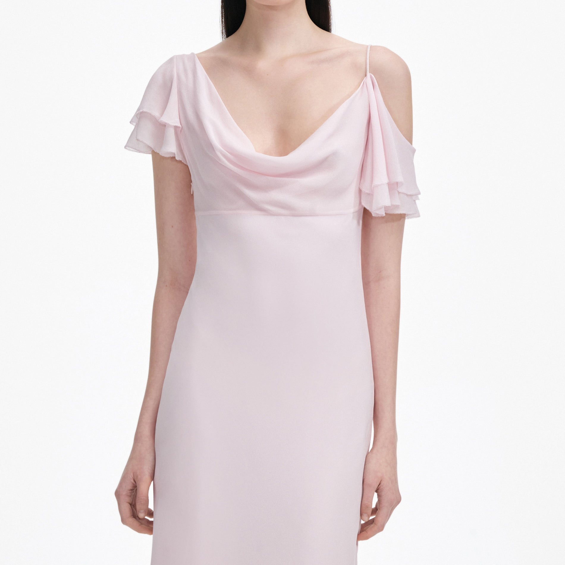 A close up of a woman wearing the Pink Georgette Frill Midi Dress