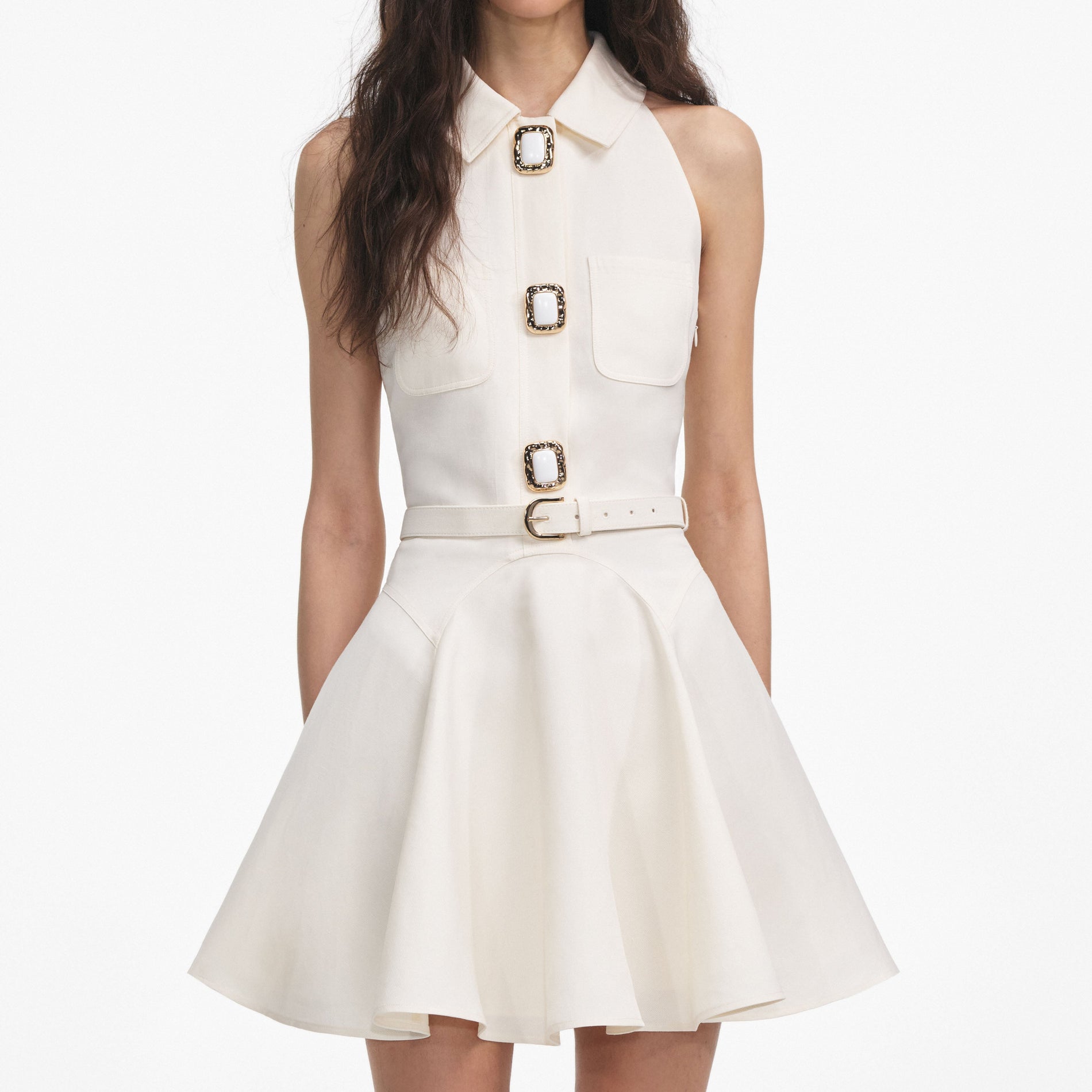 A close up of a woman wearing the Cream Linen Mini Dress