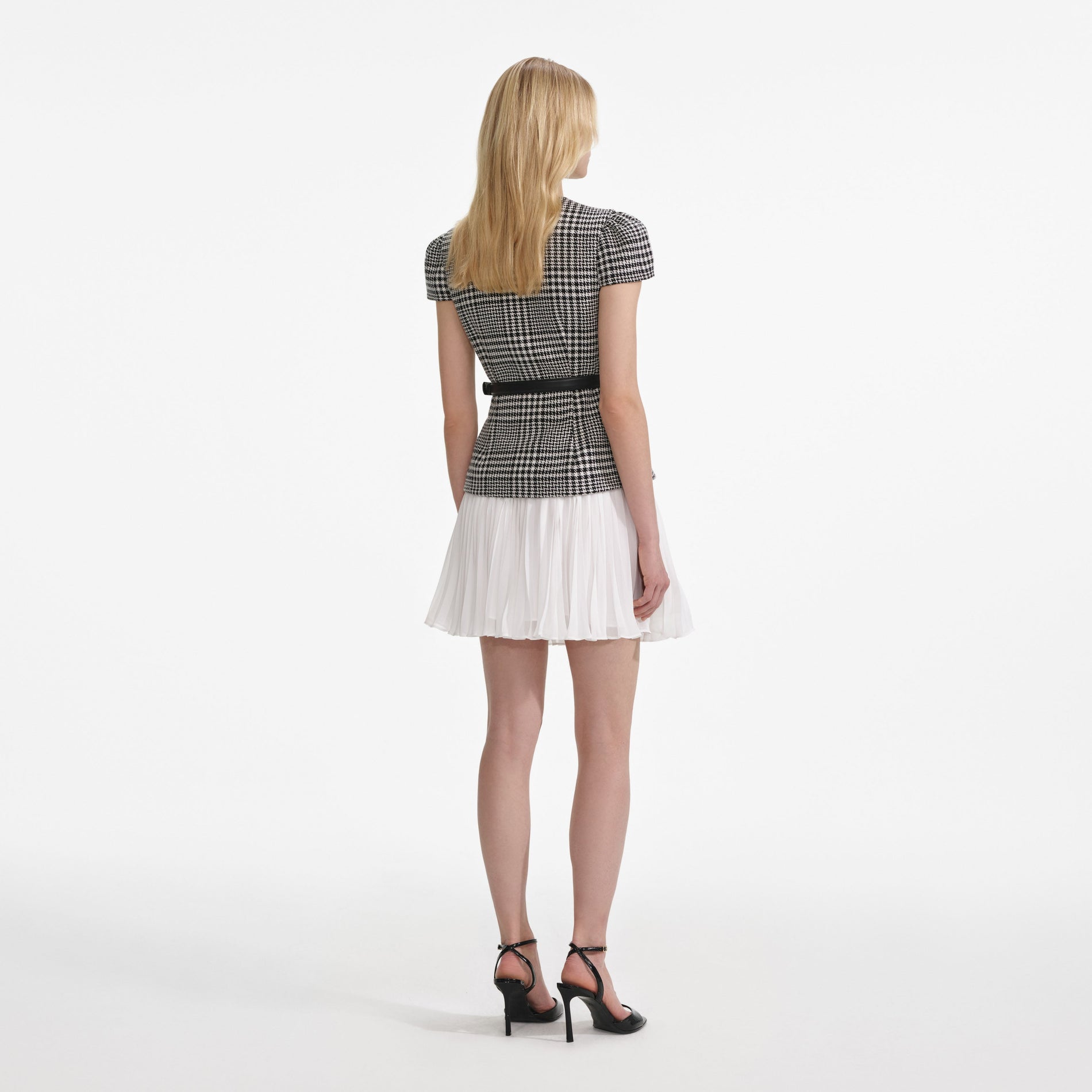 Back view of a woman wearing the Houndstooth Mini Dress