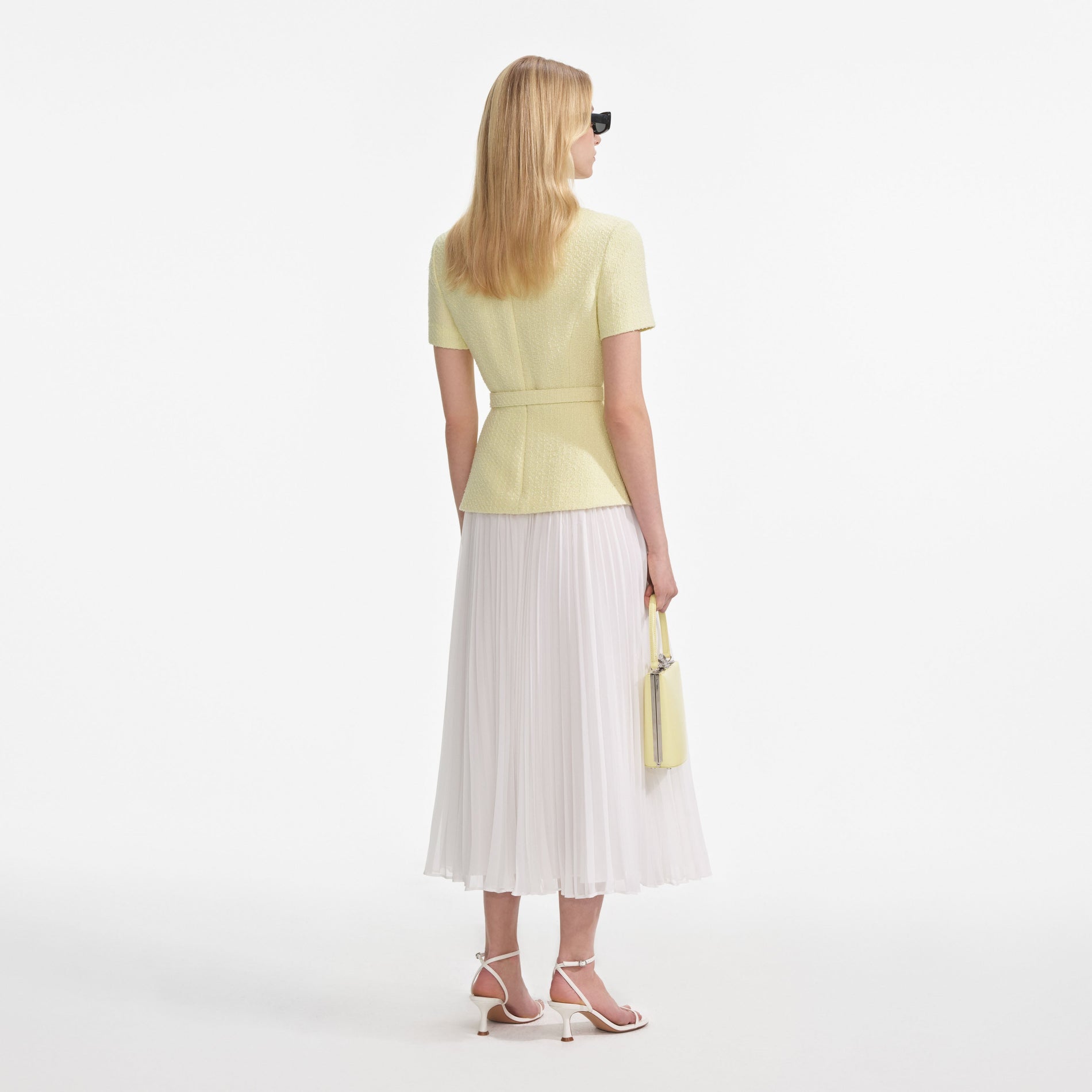 Back view of a woman wearing the Yellow Boucle Midi Dress