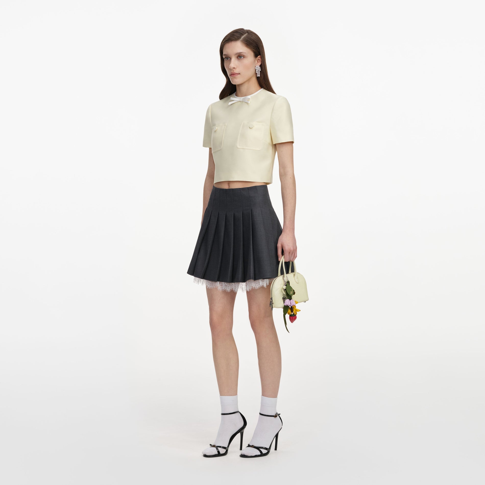 Side view of a woman wearing the Yellow Taffeta Top