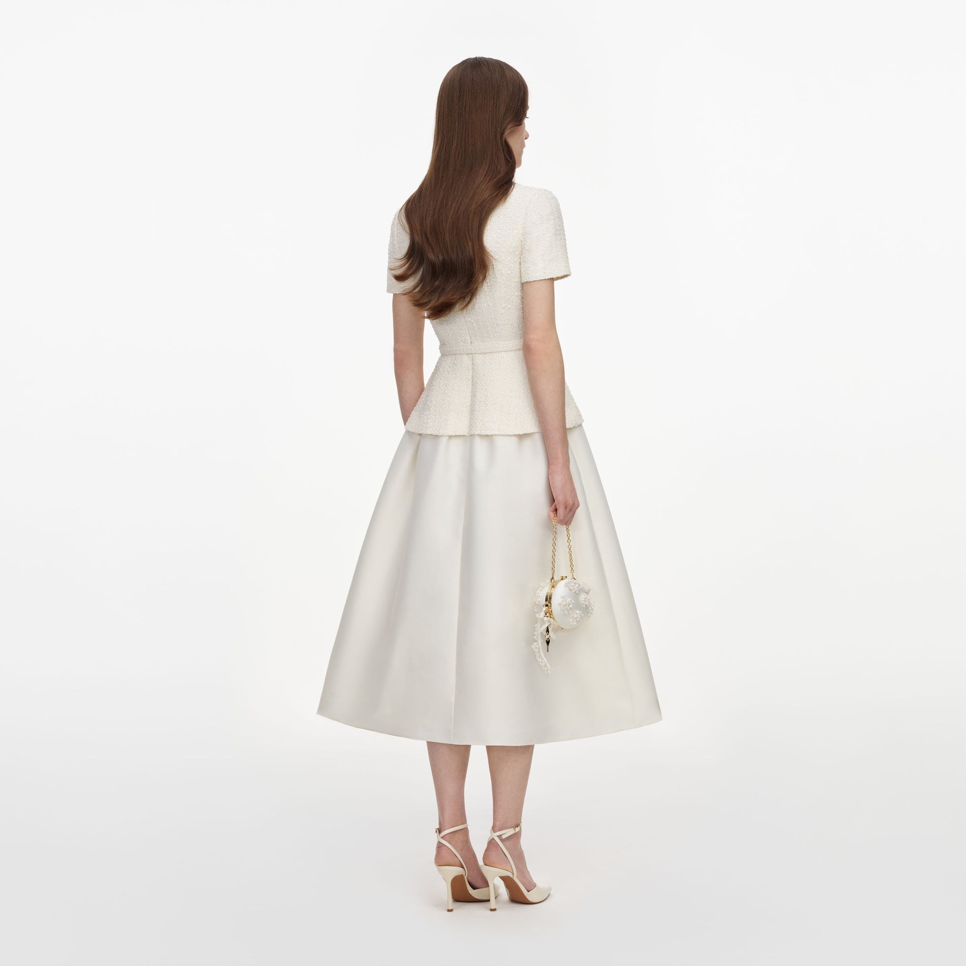 Back view of a woman wearing the Cream Boucle Taffeta Midi Dress