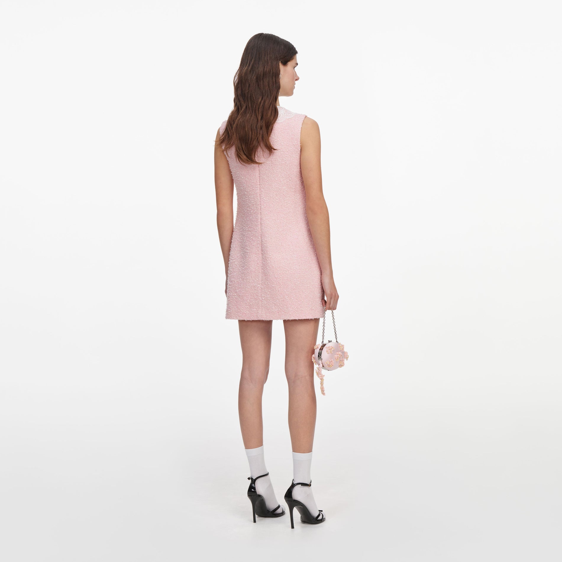 Back view of a woman wearing the Pink Boucle Lace Collar Mini Dress