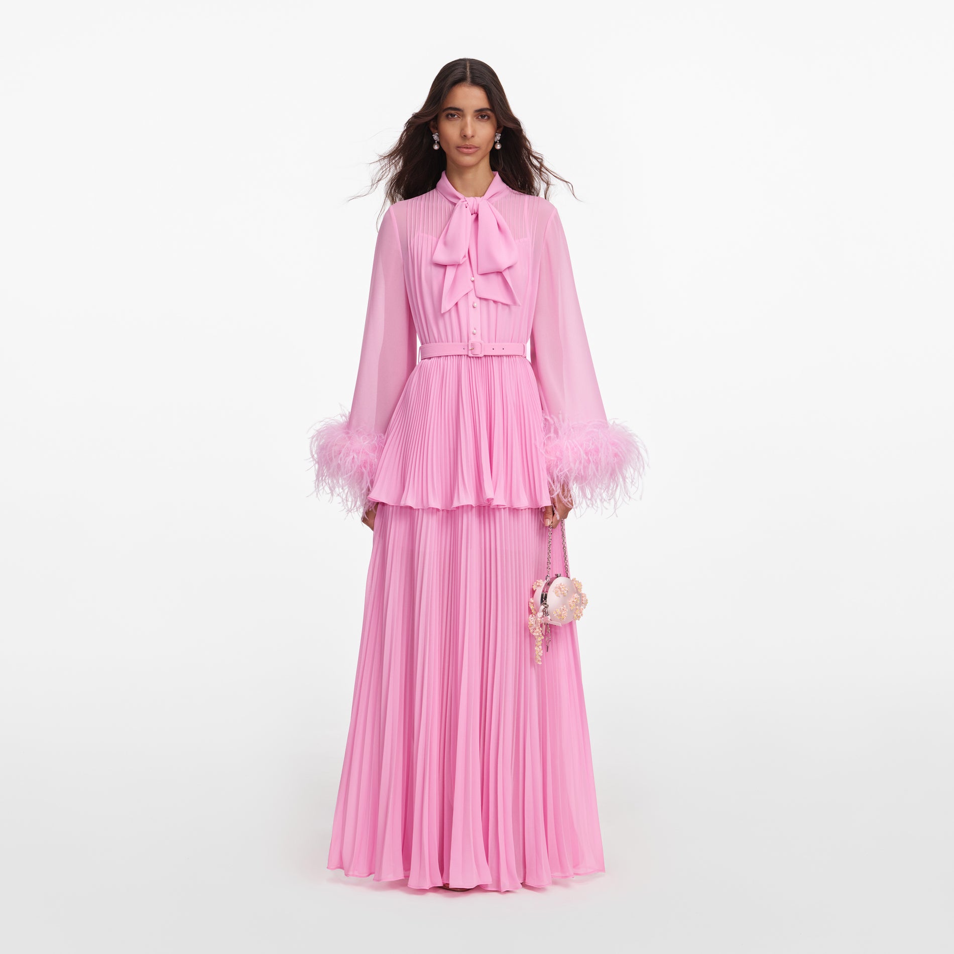 Front view of a woman wearing the Pink Georgette Feather Cuff Maxi Dress