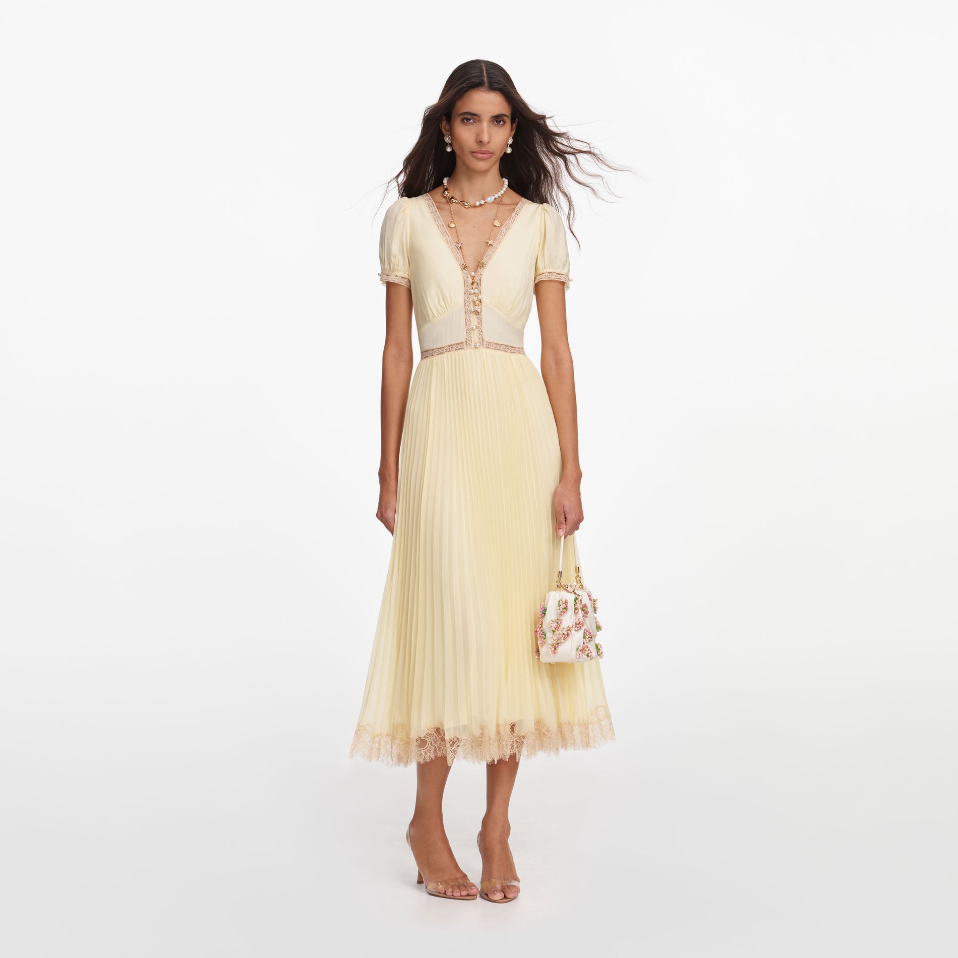 Front view of a woman wearing the Yellow Viscose Pleated Lace Midi Dress